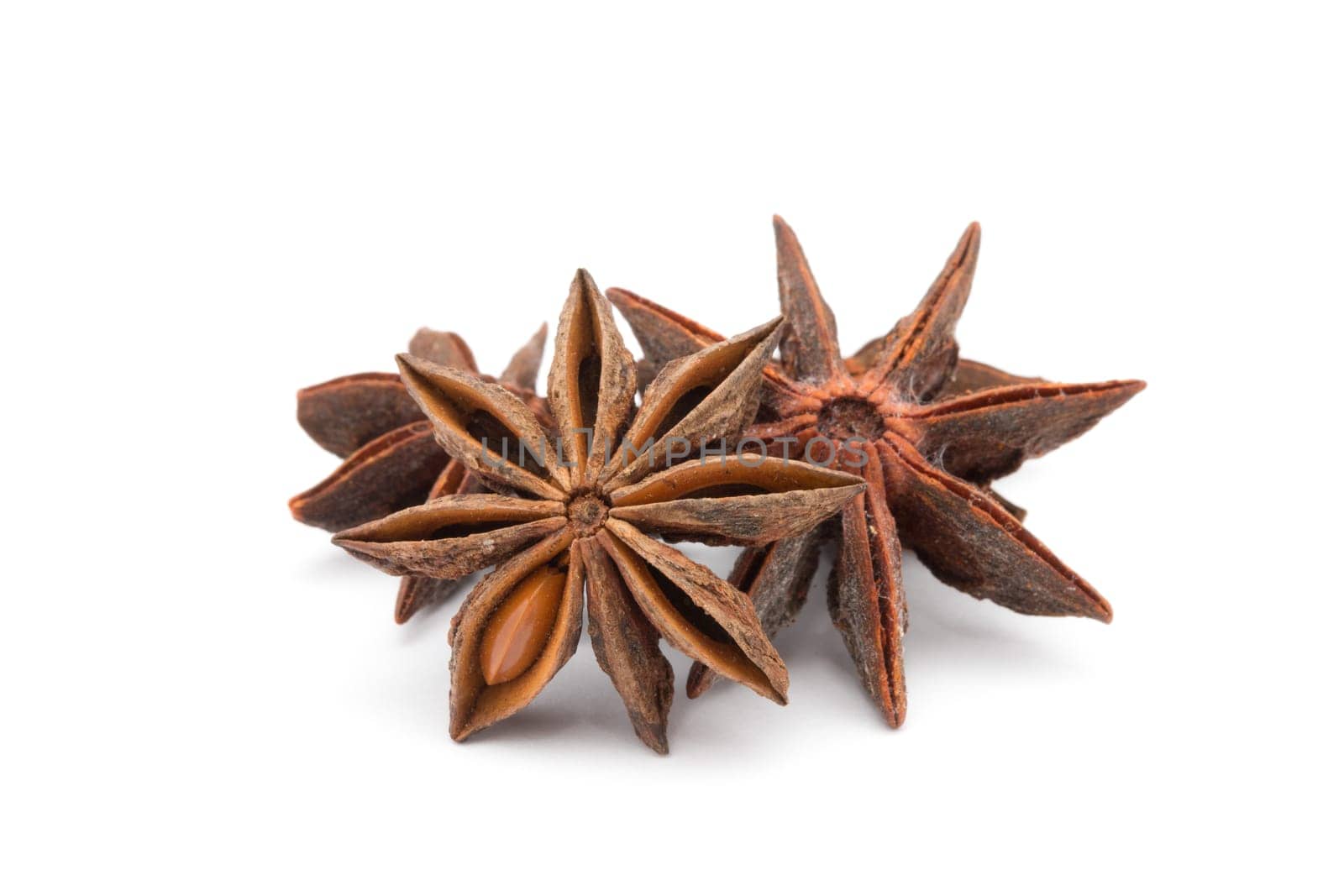 Anise stars on a white background