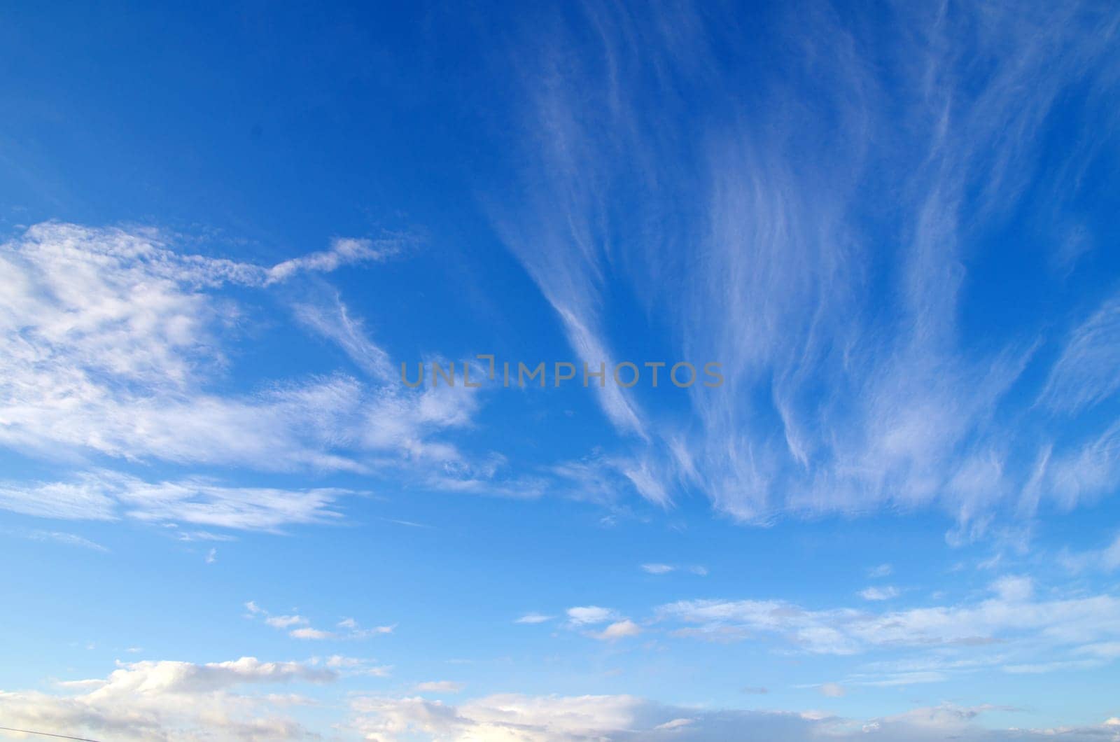 blue sky background with tiny clouds