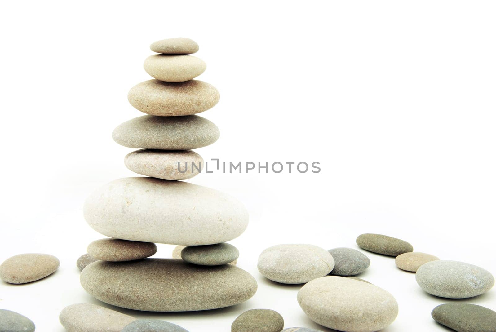 Stack of balanced stones on a white background