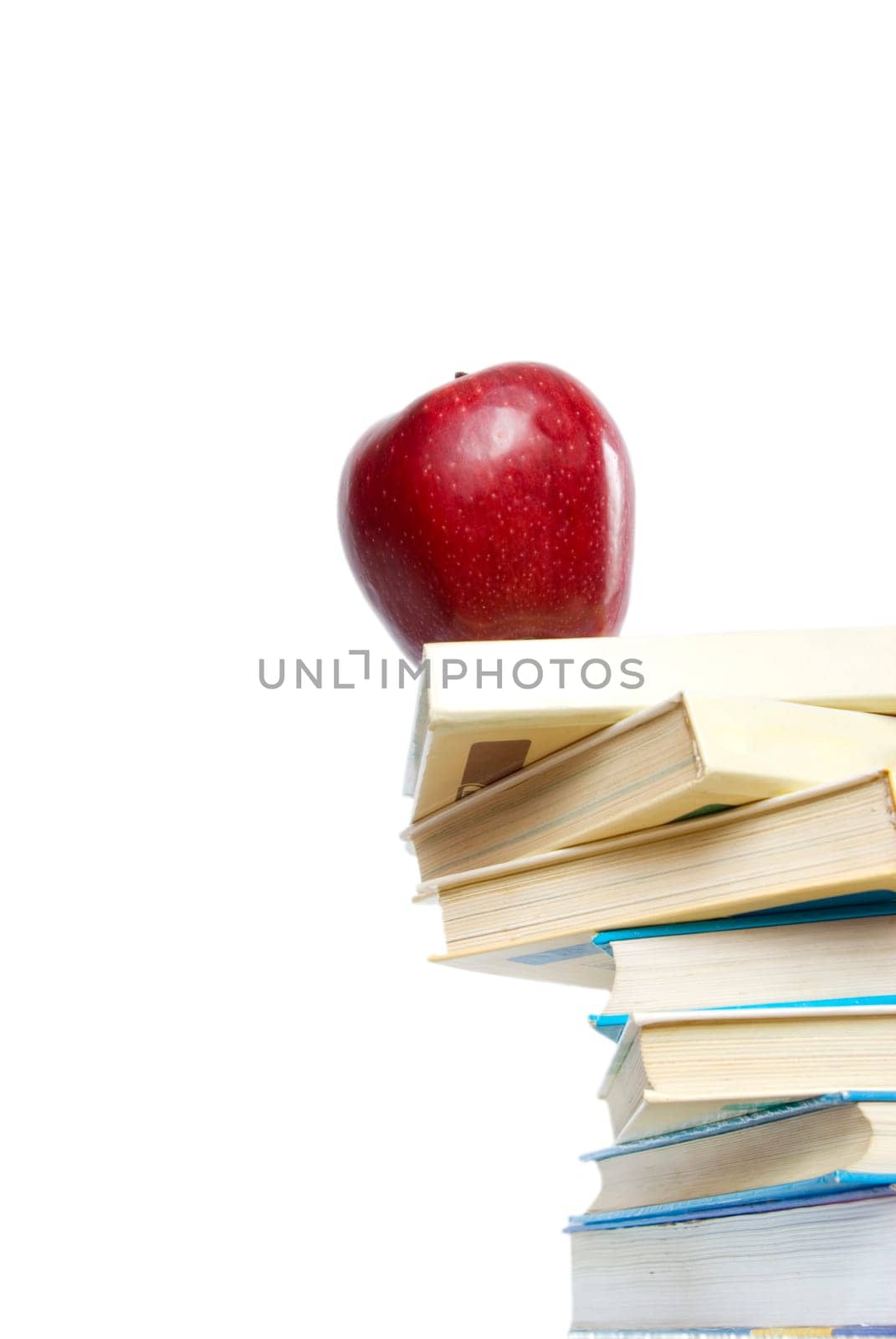 Red apple and stack of books
