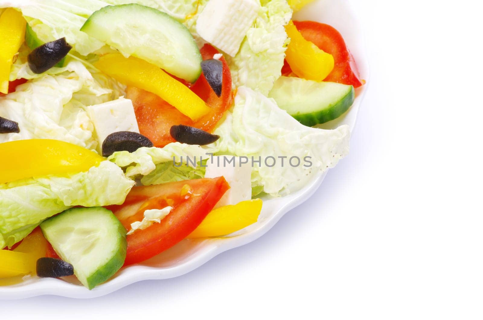 salad in plate on white