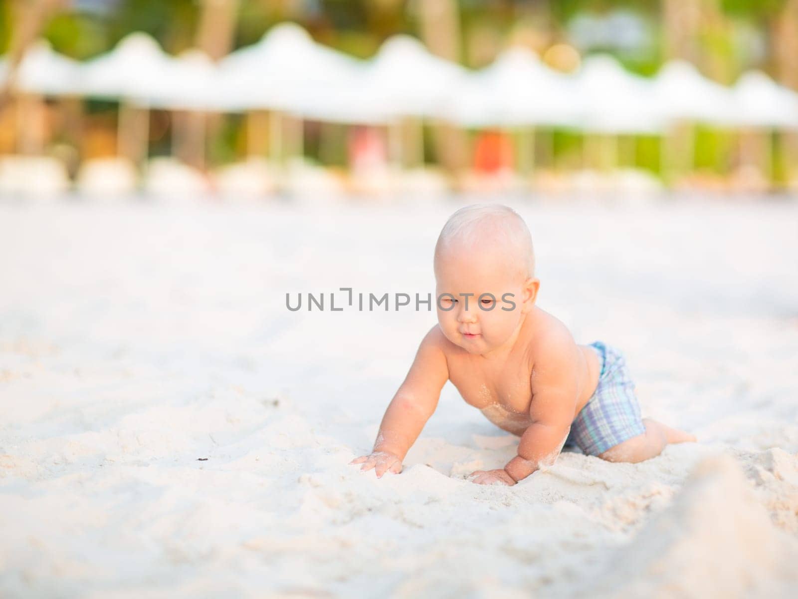 Cute baby on the tropical beach