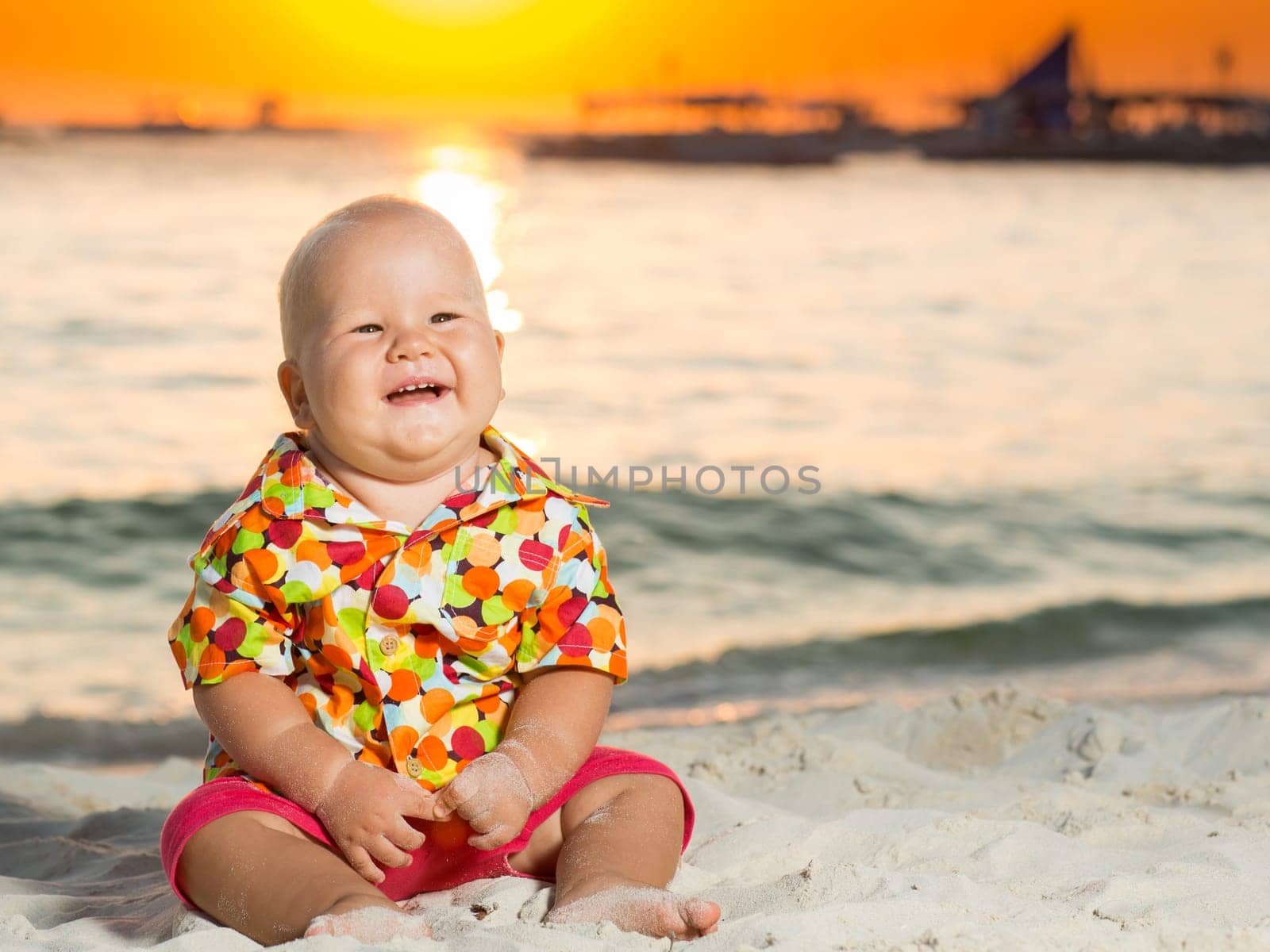 Cute baby on the tropical beach
