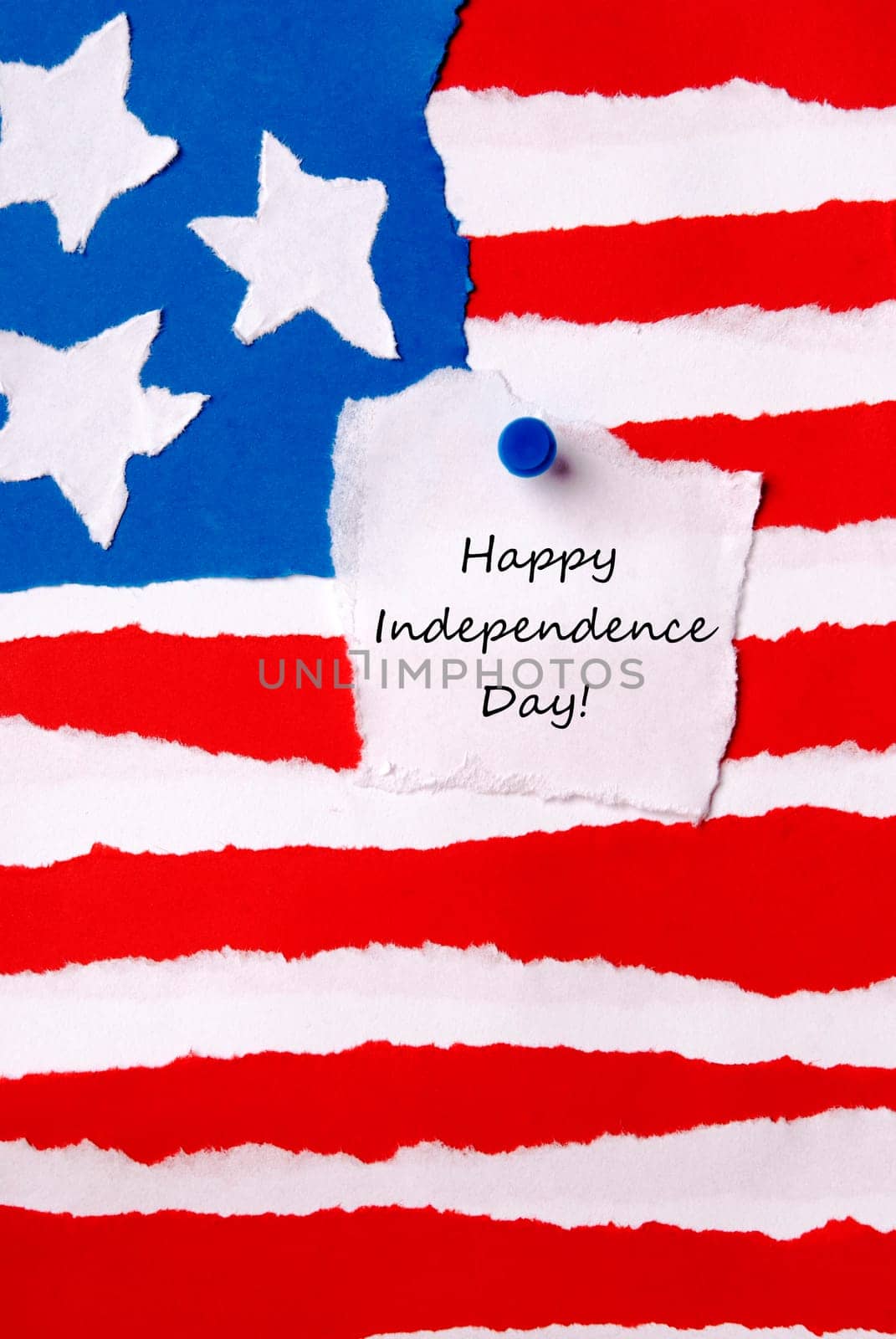 American Flag as Paper Background with a Note on which stands Happy Independence Day