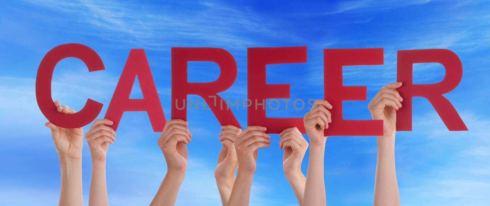 hands holding four pieces of a puzzle with copy space, gray background