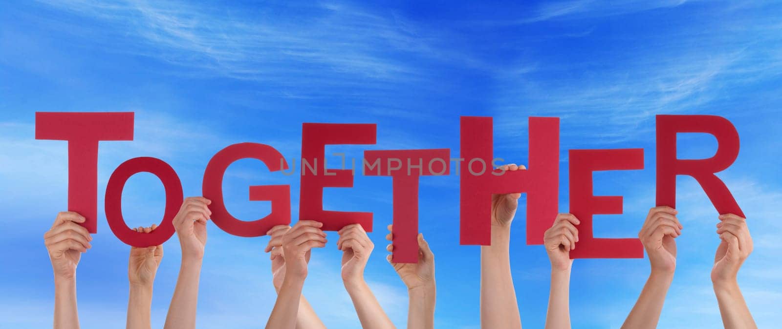 hands holding four pieces of a puzzle with copy space, gray background