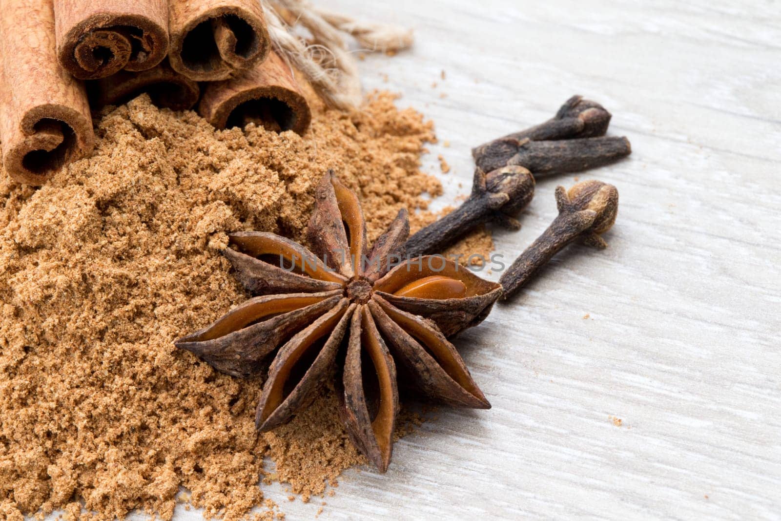 Cloves, anise and cinnamon isolated on white background