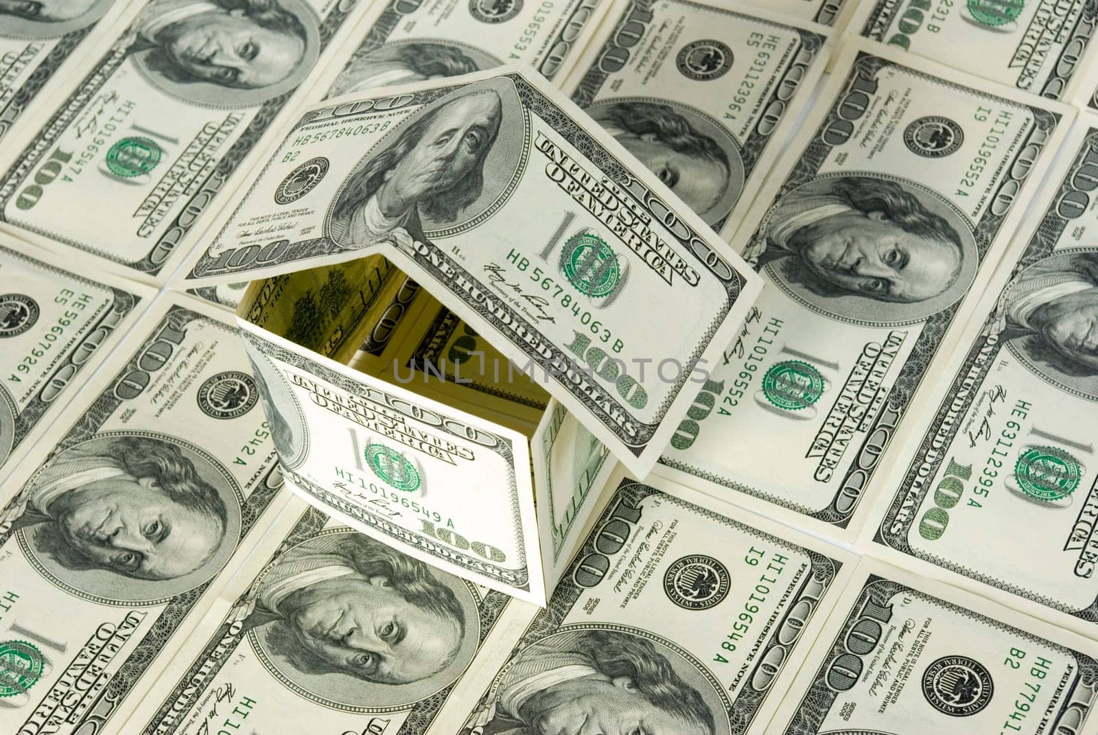 Money house on dollars background