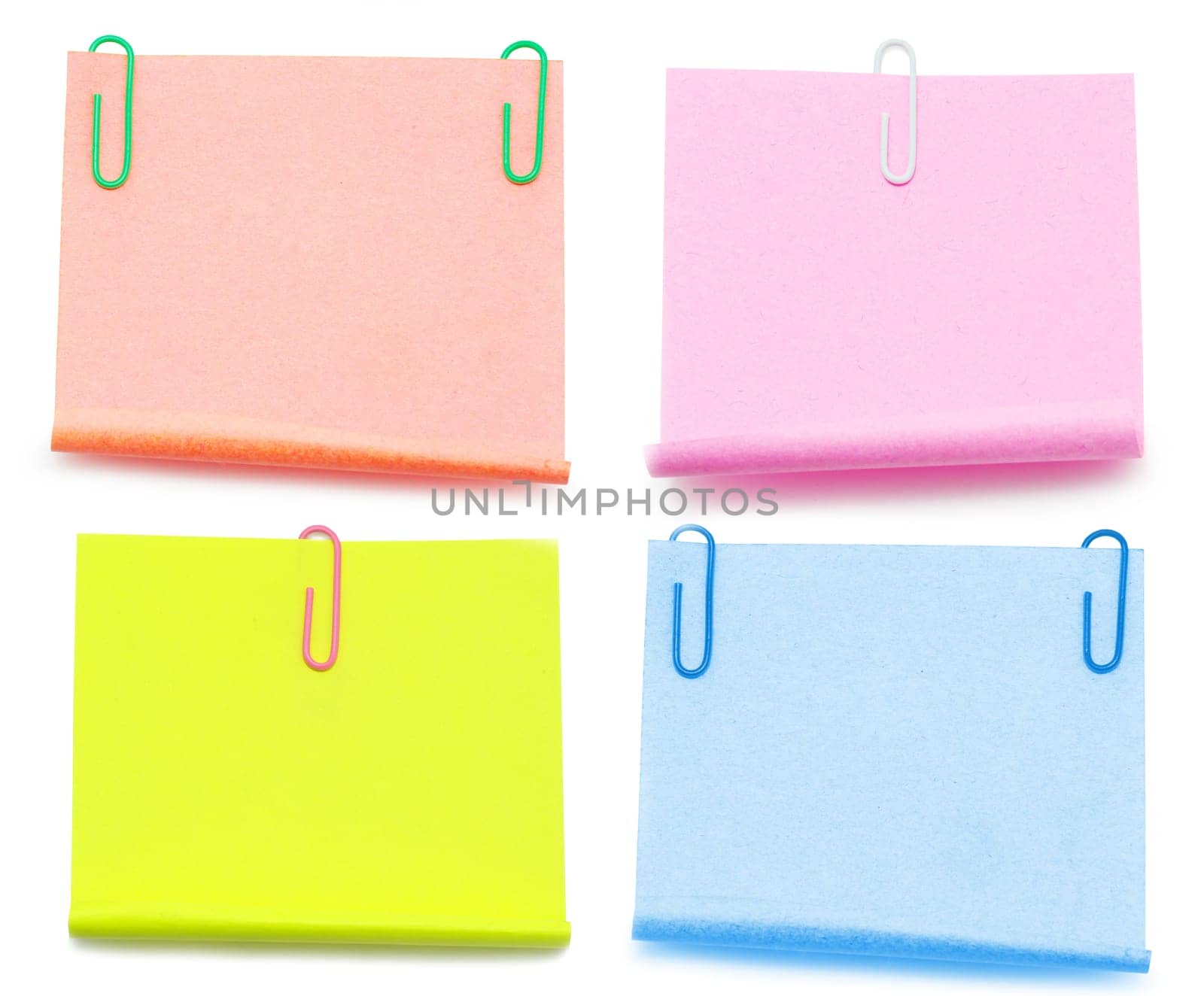 Blank note paper and red paper-clip isolated  on white