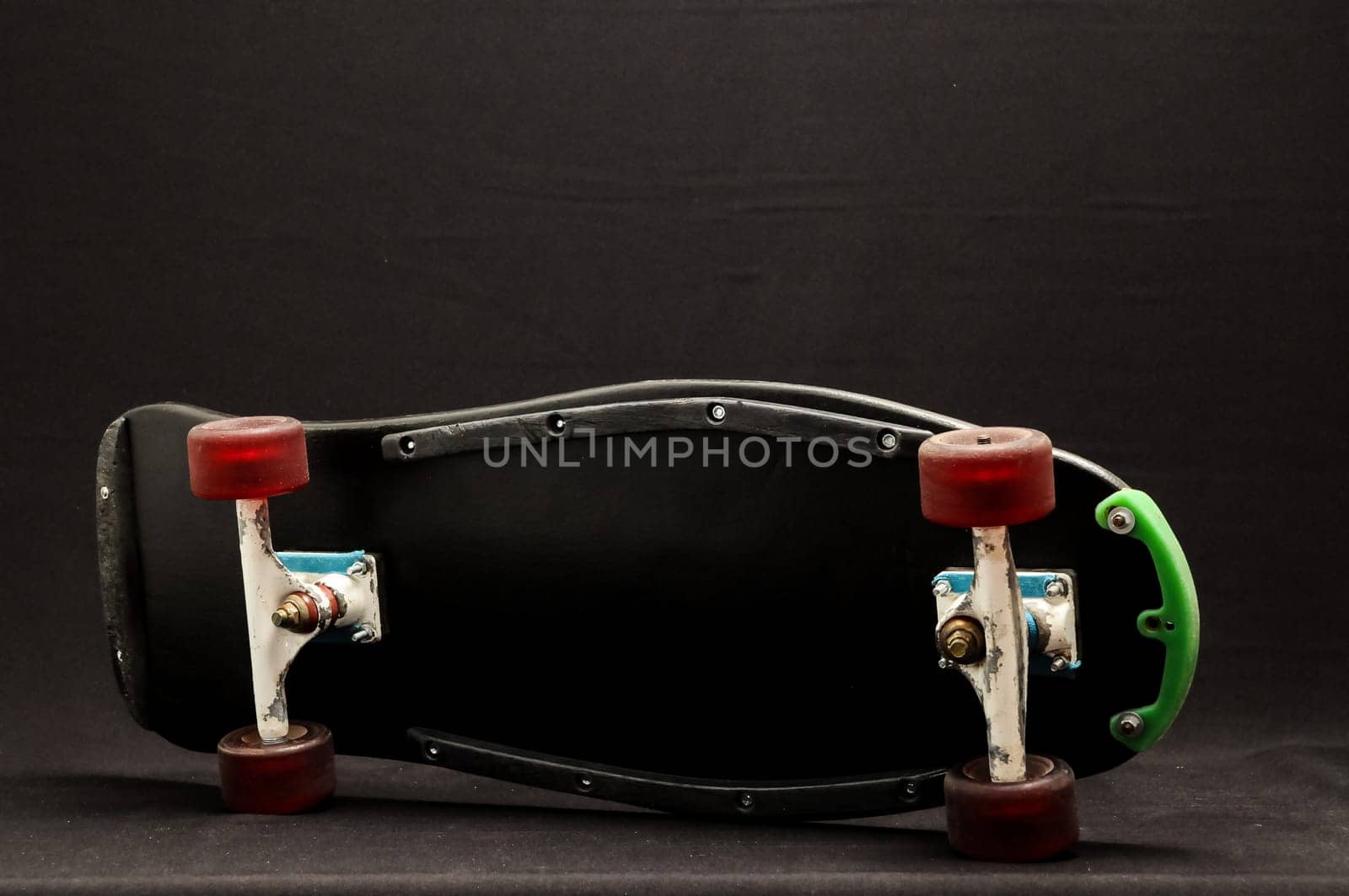 Vintage Style Black Skateboard on a black Background