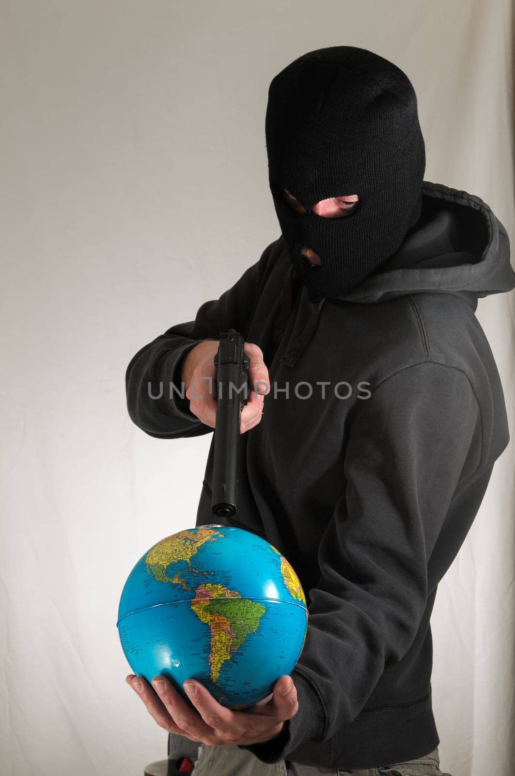 Black Dressed Young Man Holding a Globe Earth