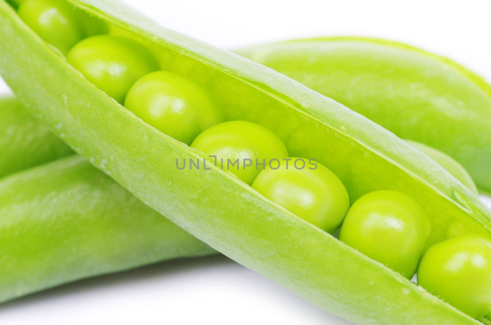 green peas vegetable closeup isolated on white