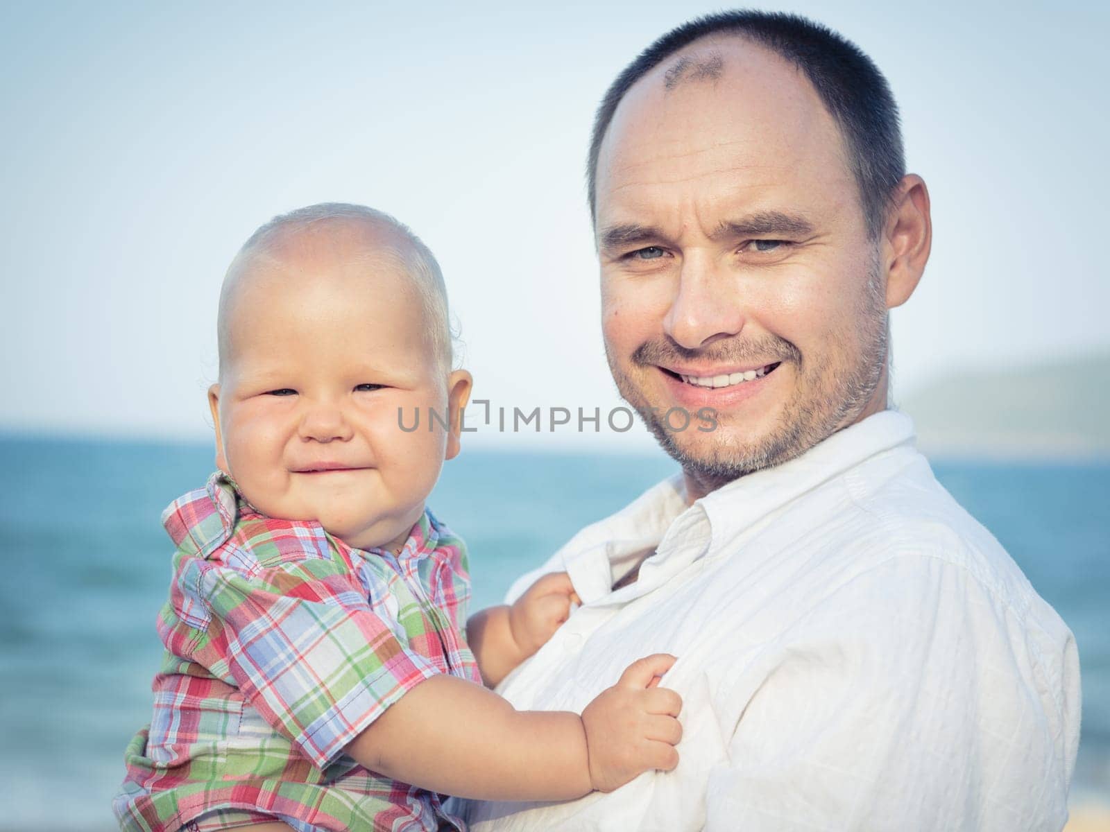 Baby and father outdoor portrait