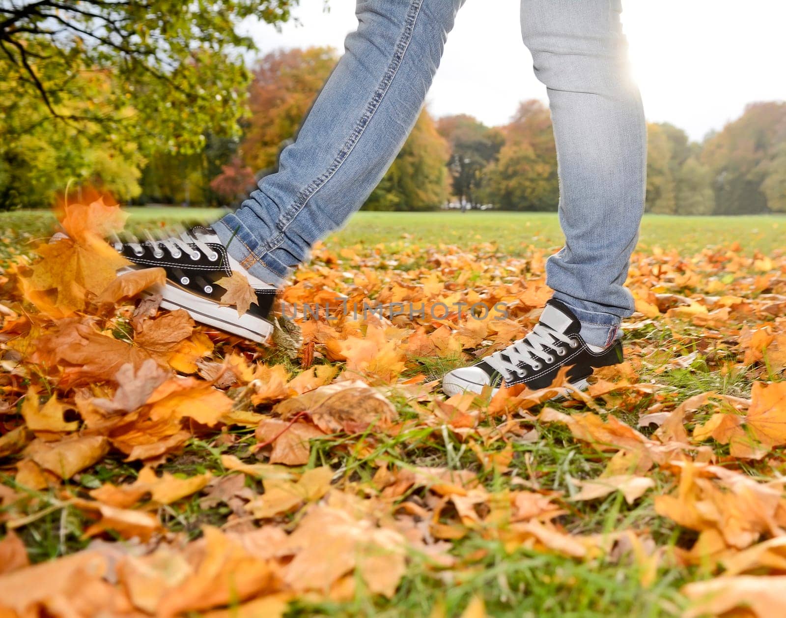 Feet in autumn foliage