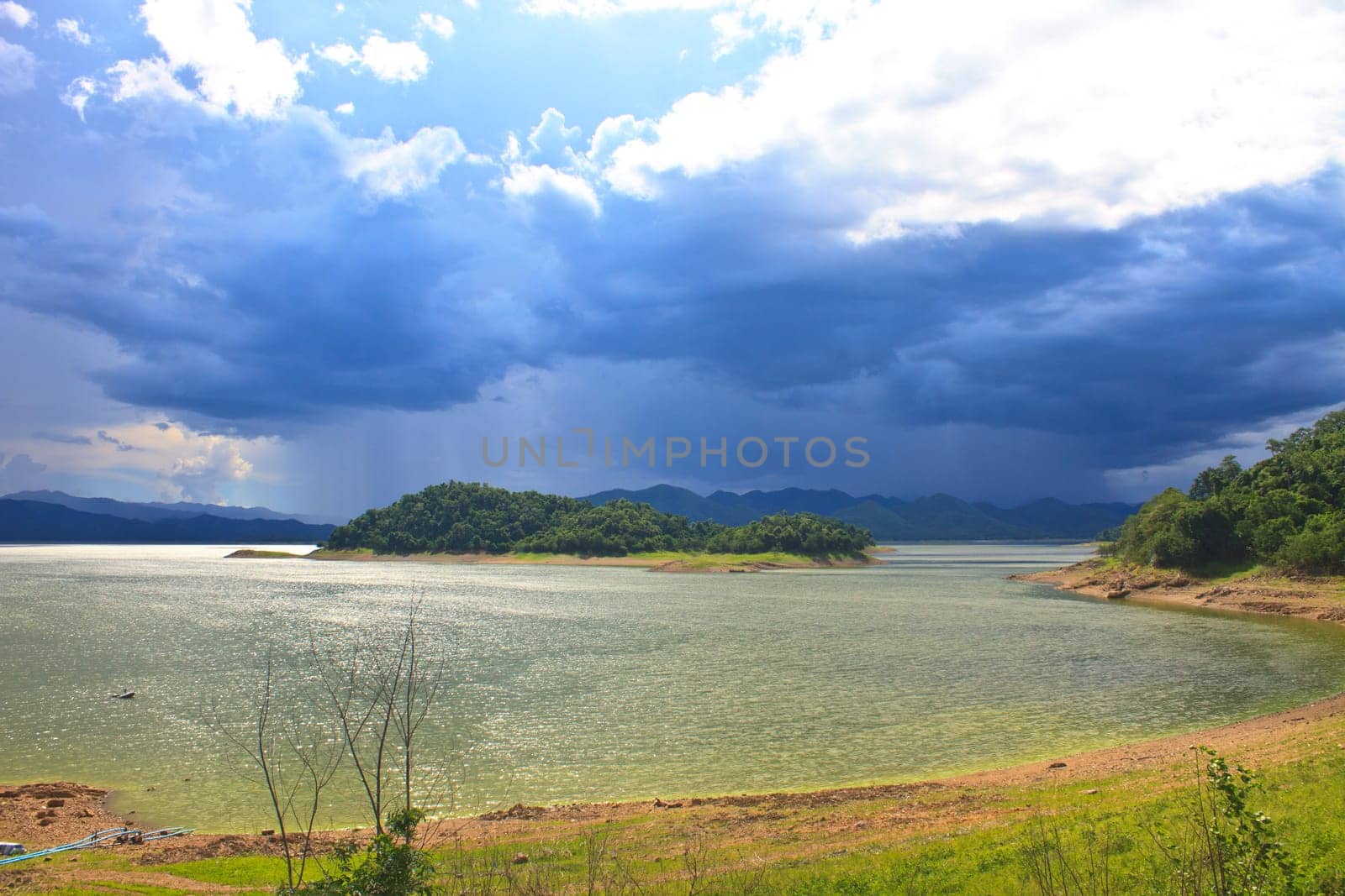 dark storm clouds before rain at over lake