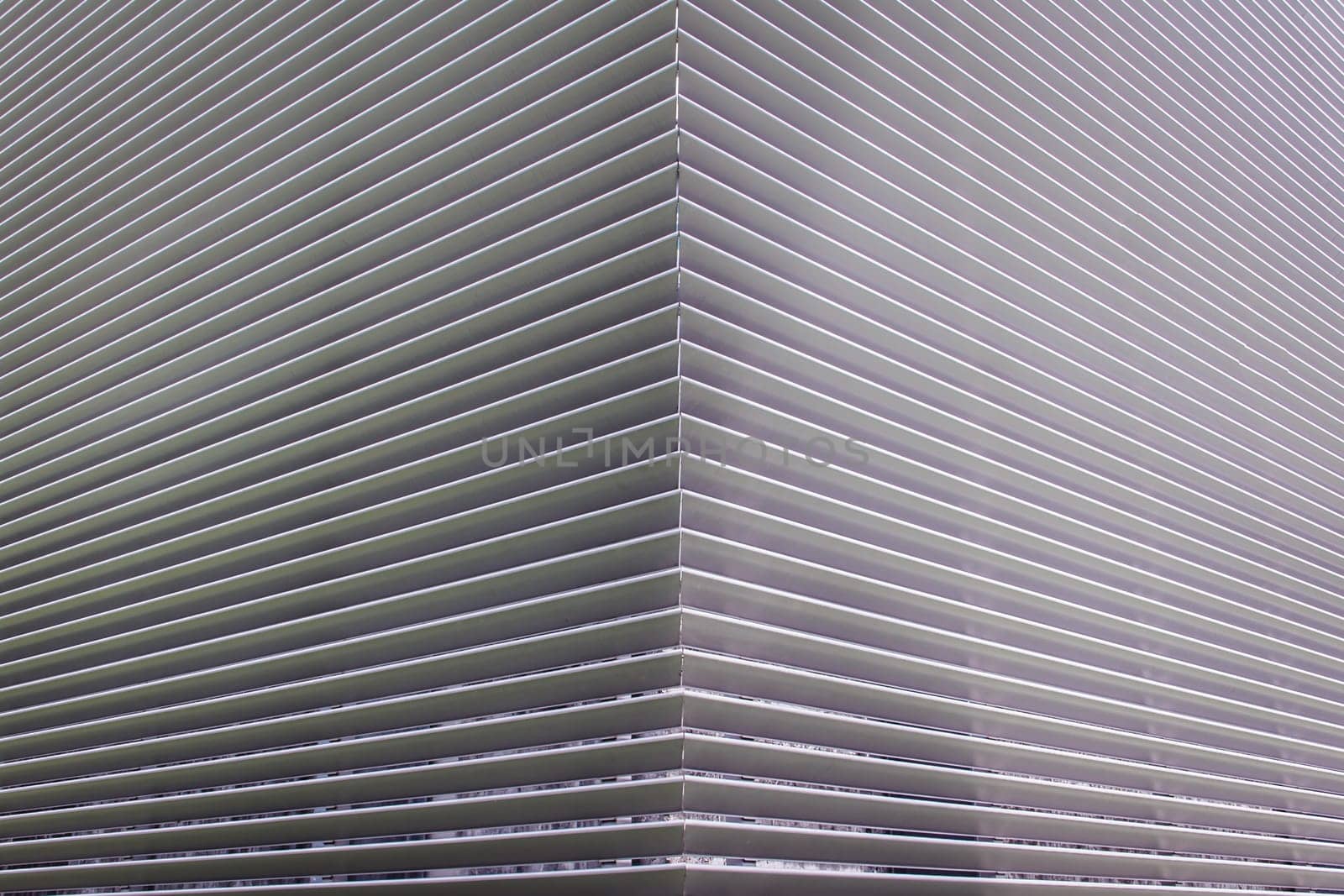 texture of steel ventilation grille on the wall of a building