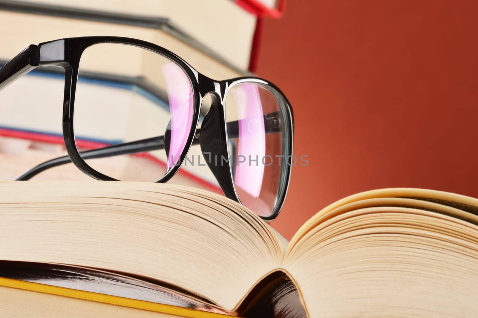 Composition with glasses and books on the table