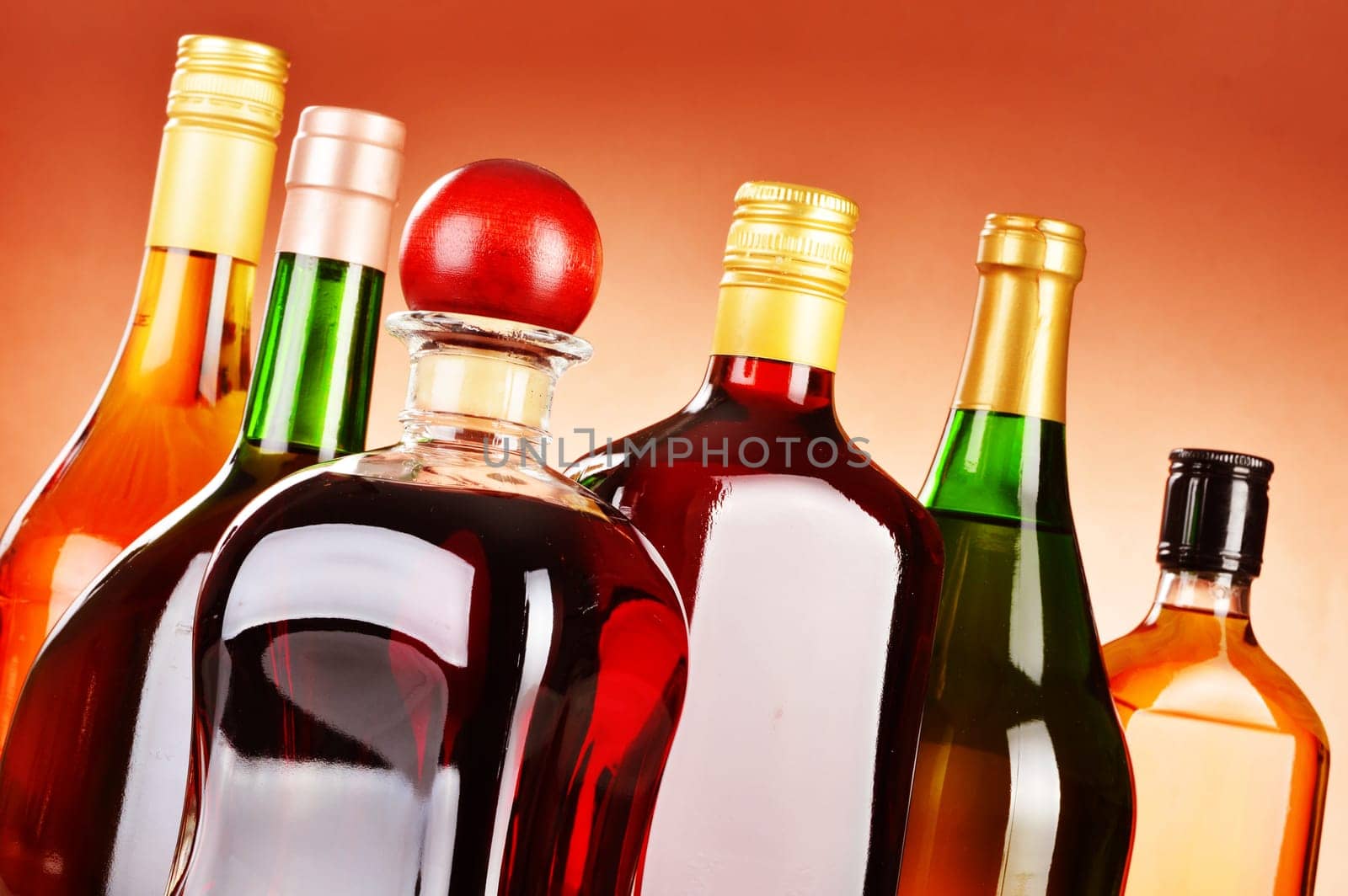 Bottles of assorted alcoholic beverages including beer and wine