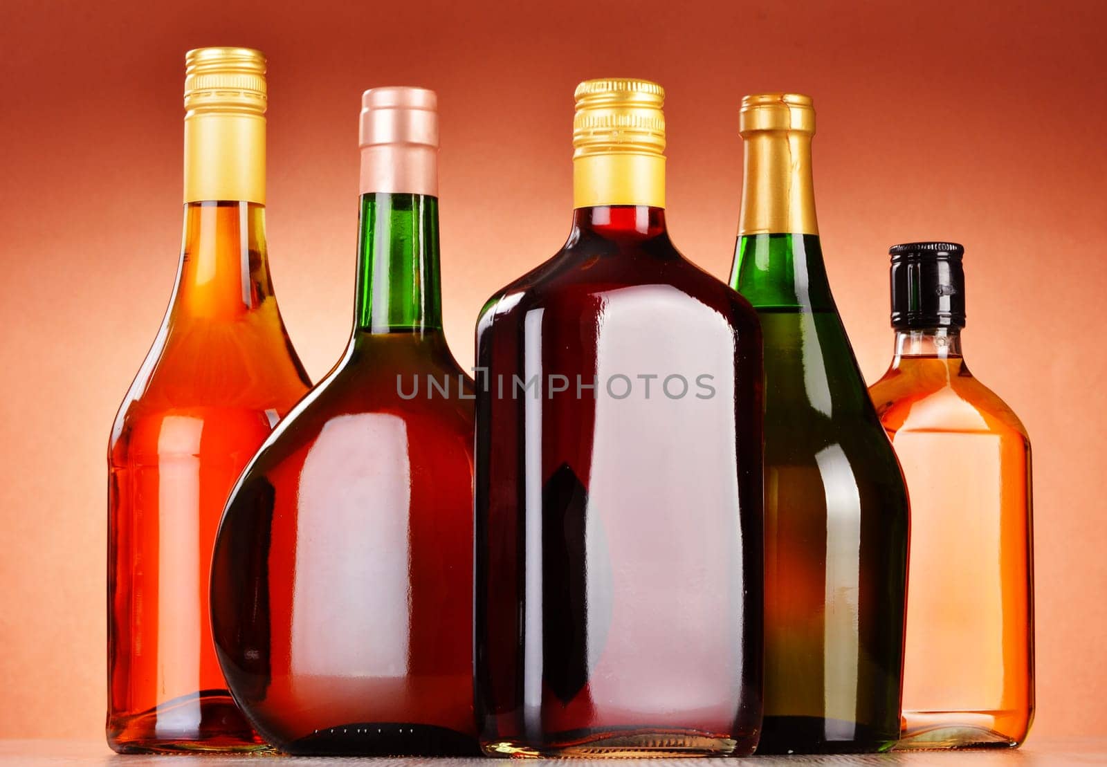 Bottles of assorted alcoholic beverages including beer and wine