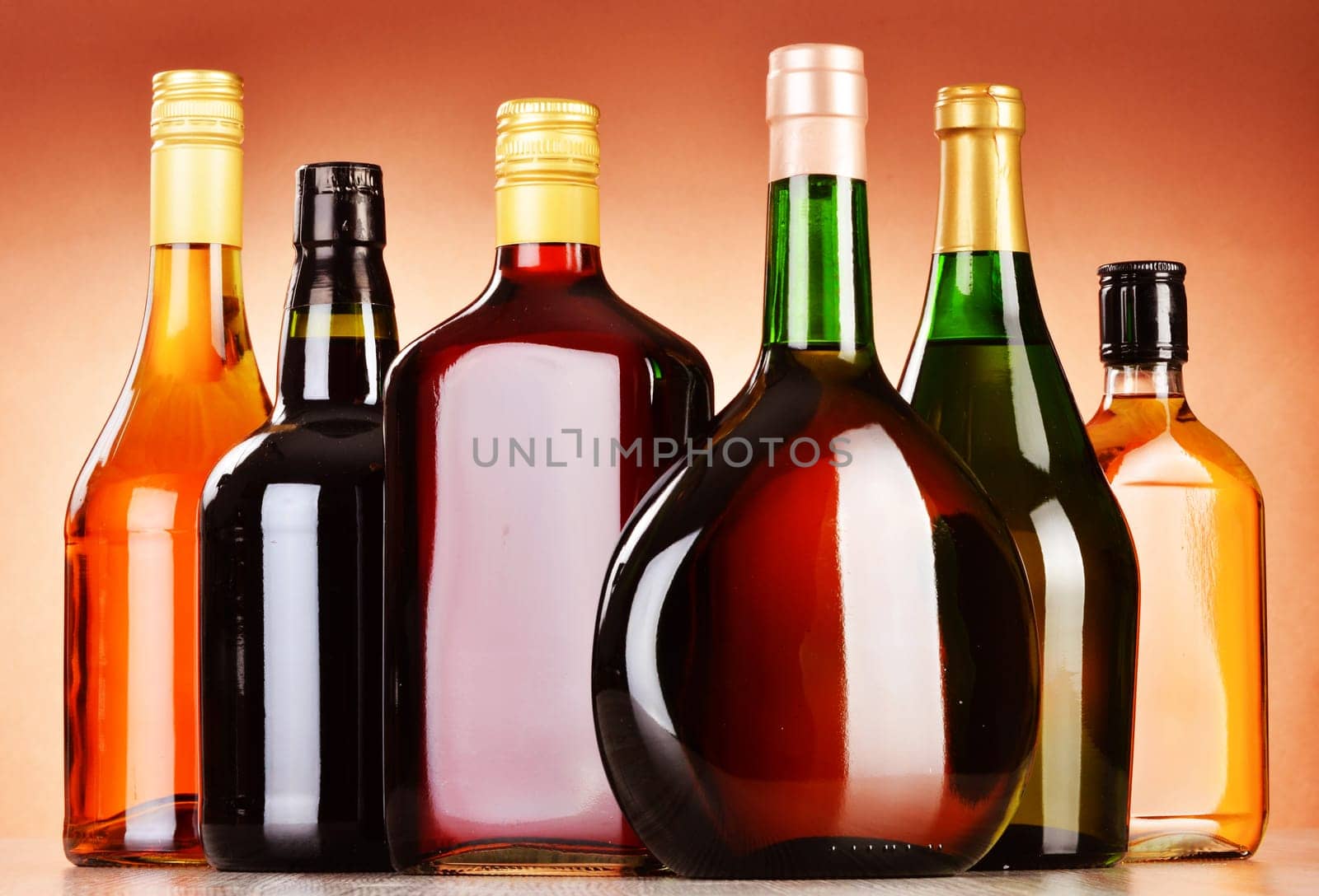 Bottles of assorted alcoholic beverages including beer and wine