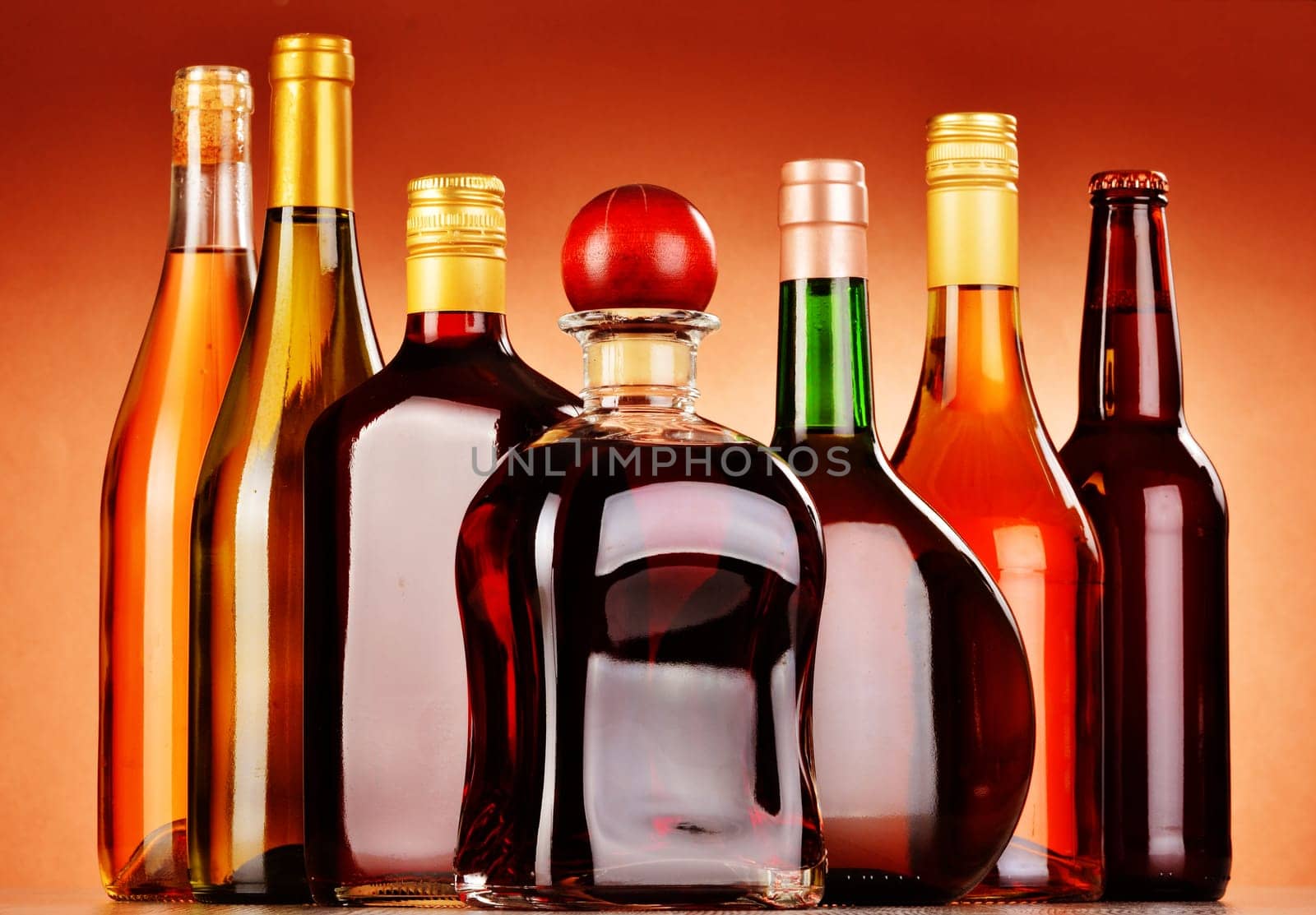 Bottles of assorted alcoholic beverages including beer and wine