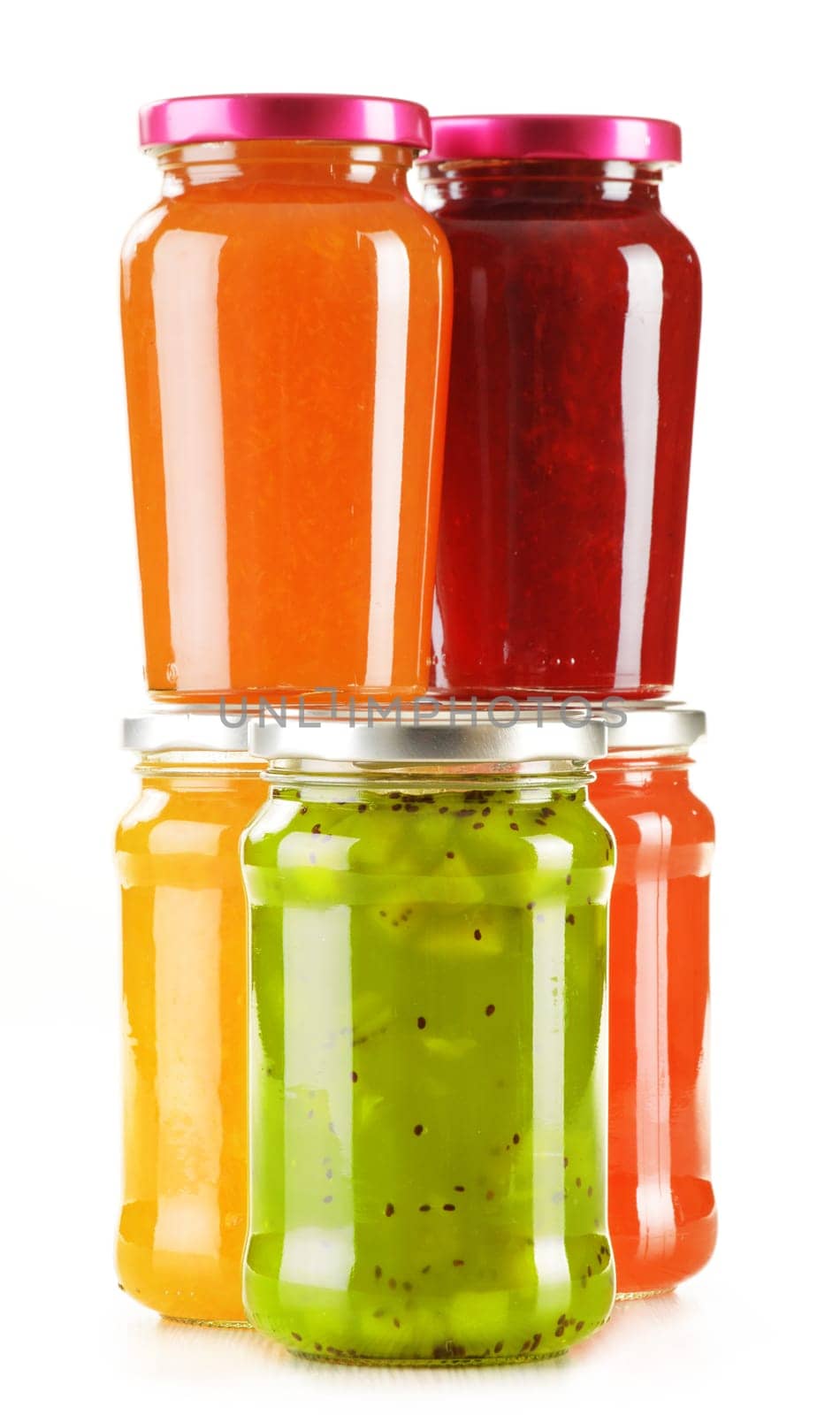 Jars of fruity jams isolated on white background. Preserved fruits