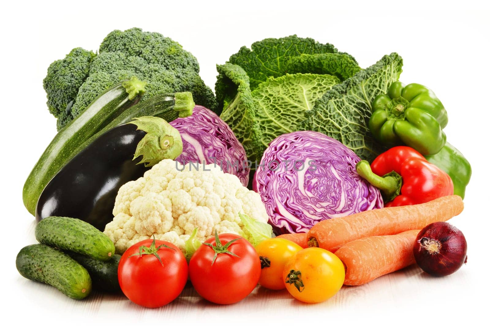Composition with variety of fresh organic vegetables isolated on white