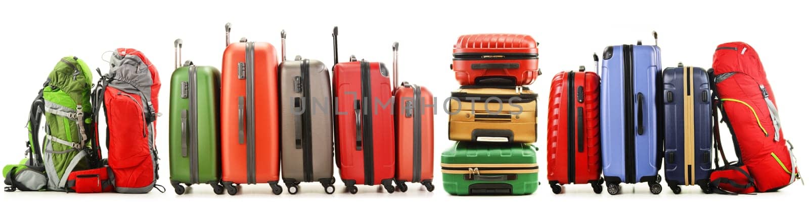 Luggage consisting of large suitcases and rucksack isolated on white.