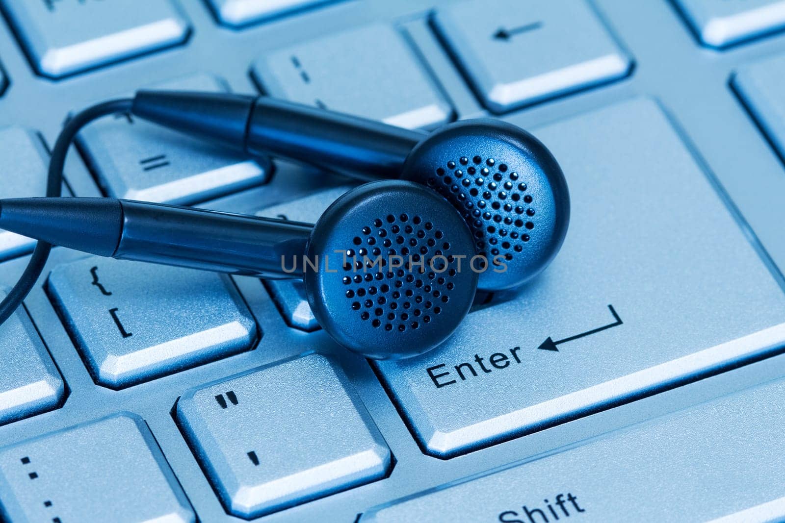 Headphones and computer keyboard, concept of digital music