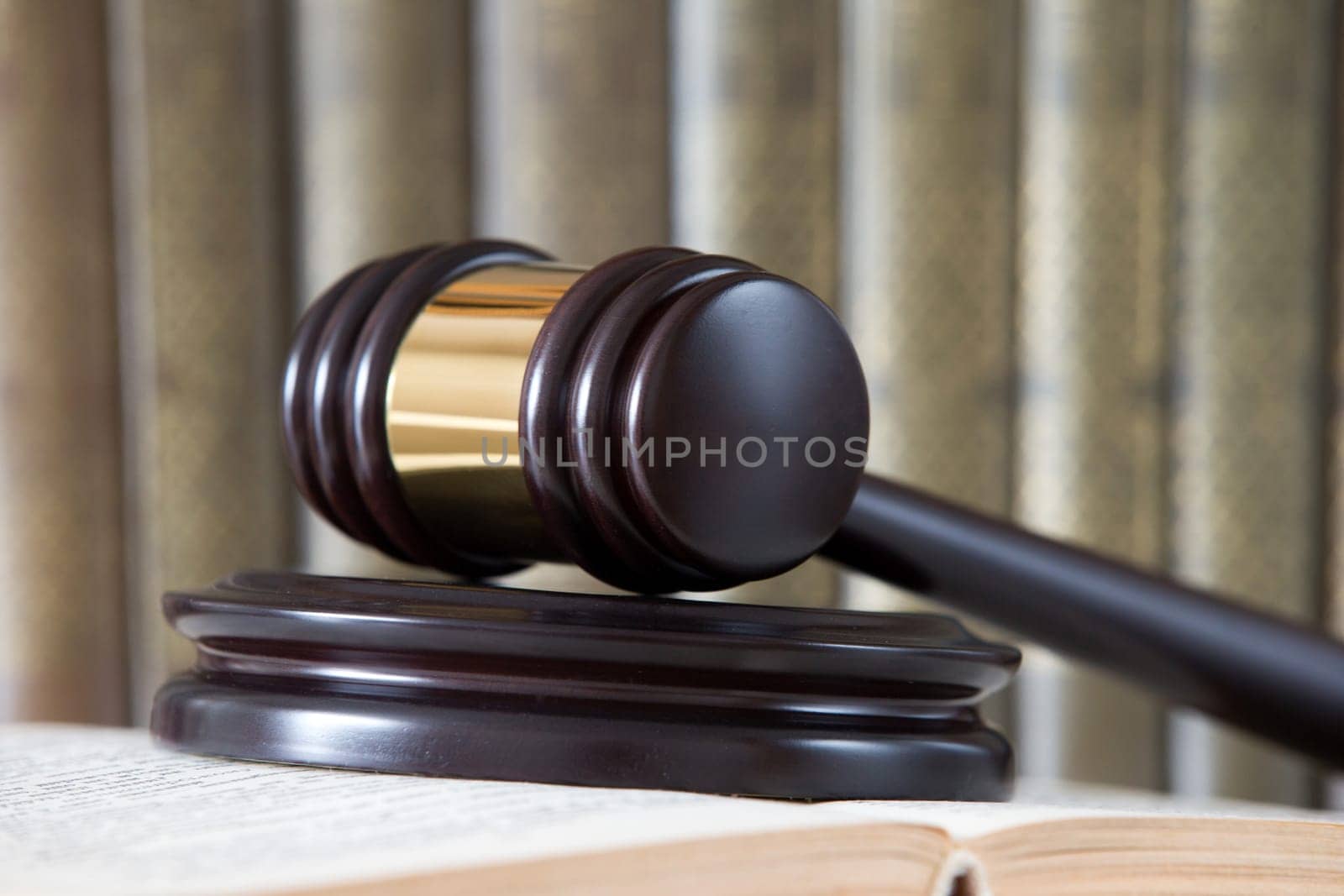 wooden gavel and books on wooden table