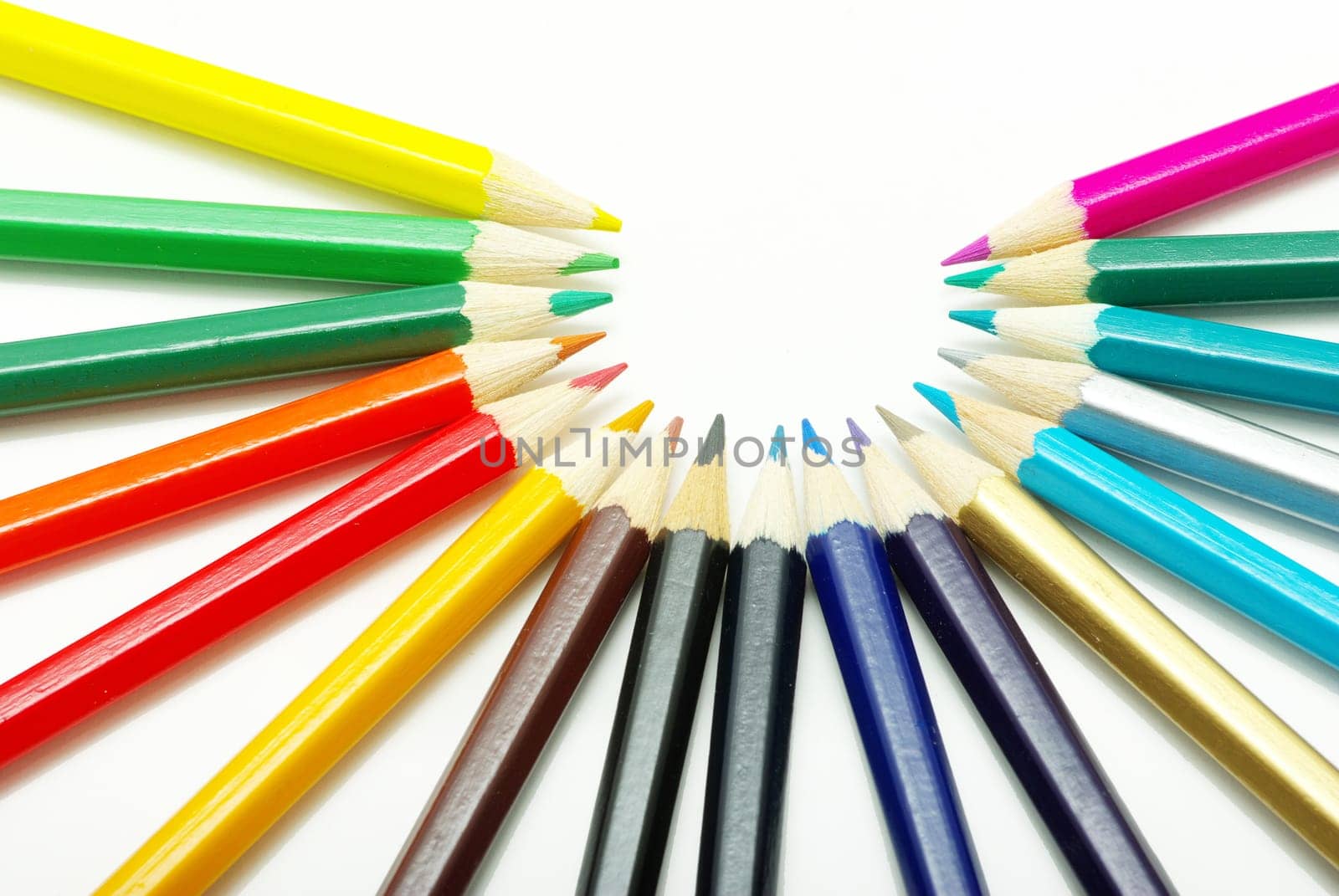 Assortment of coloured pencils  on white background