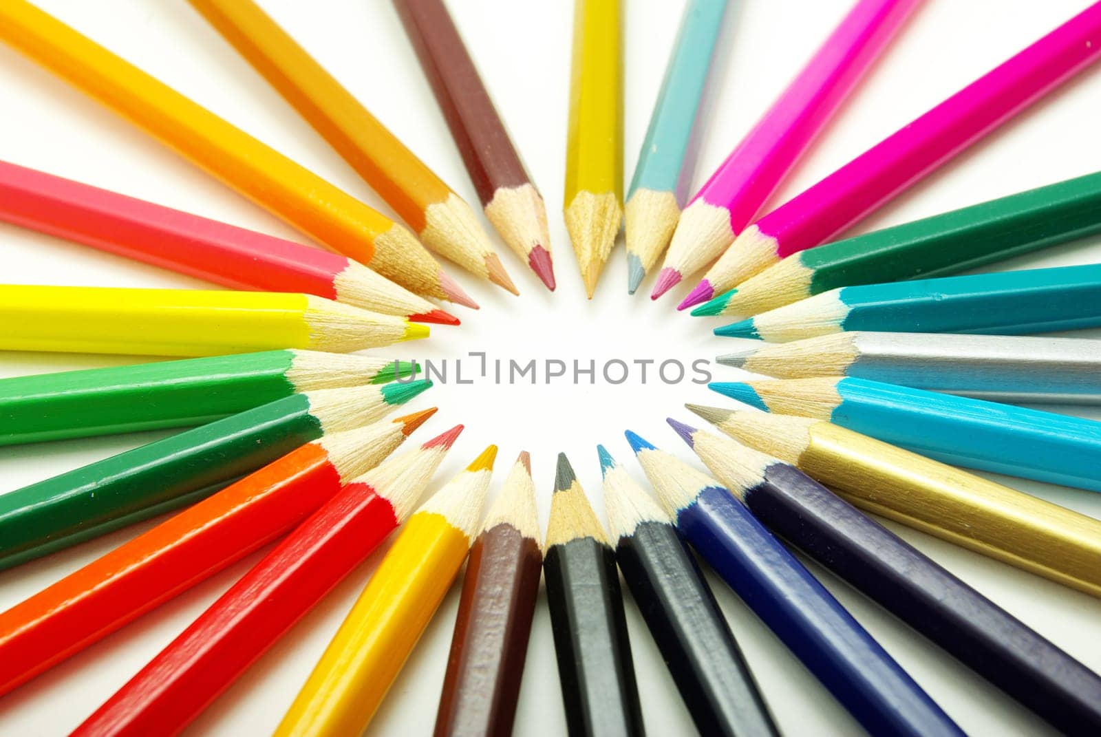 Assortment of coloured pencils  on white background