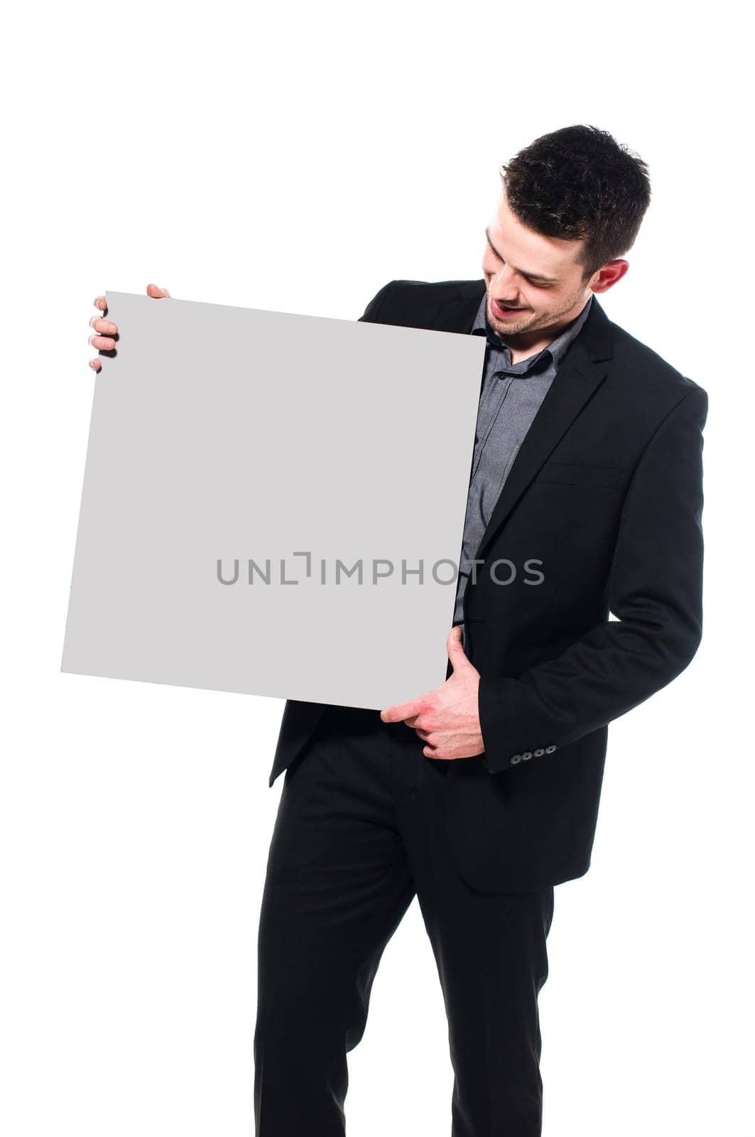 Smart Businessman holding up blank sign, isolated on white