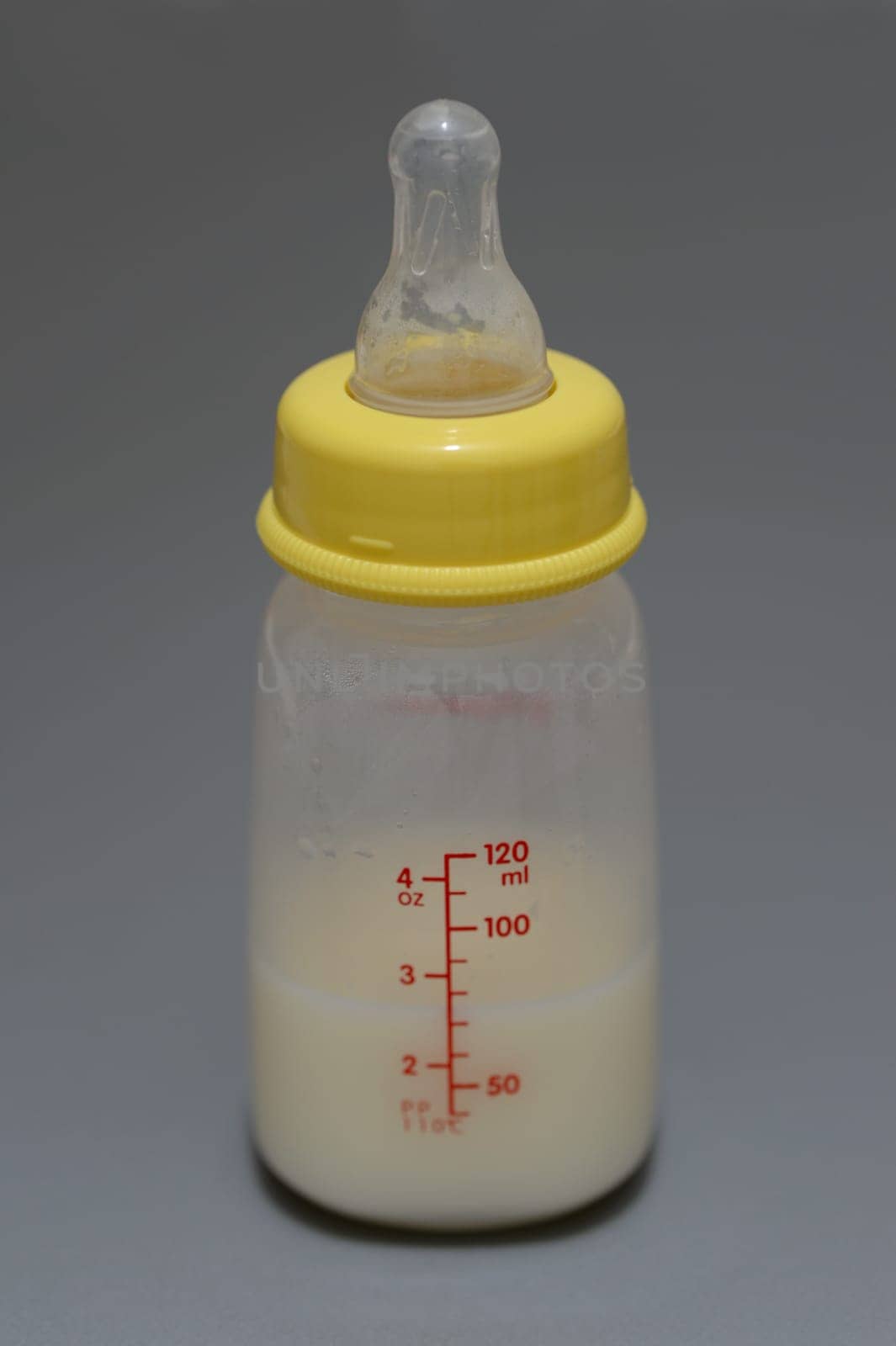 A close up shot of a baby bottle