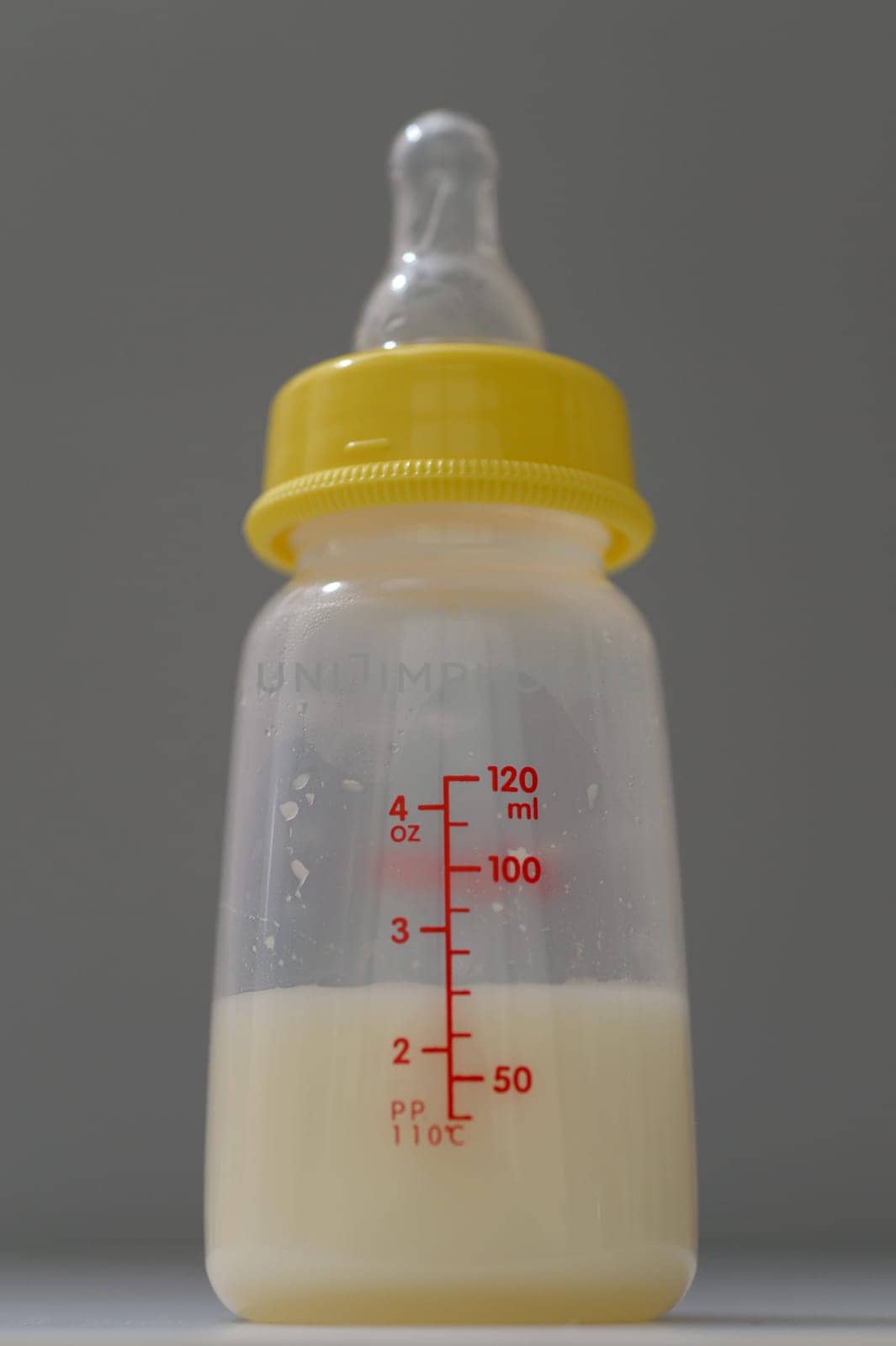 A close up shot of a baby bottle