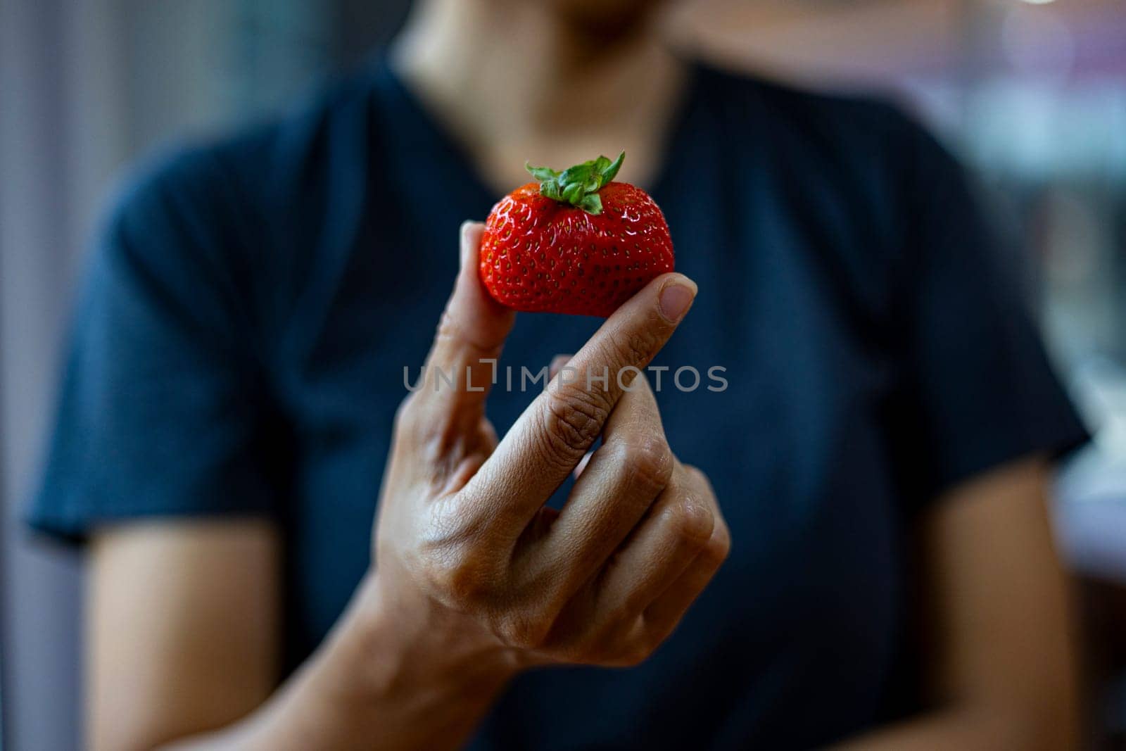 Fresh strawberries in hands ,close-up. Strawberries in female palms.