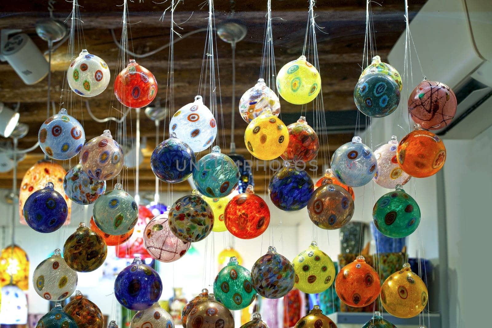 Colored glass objects in a shop window of Venice
