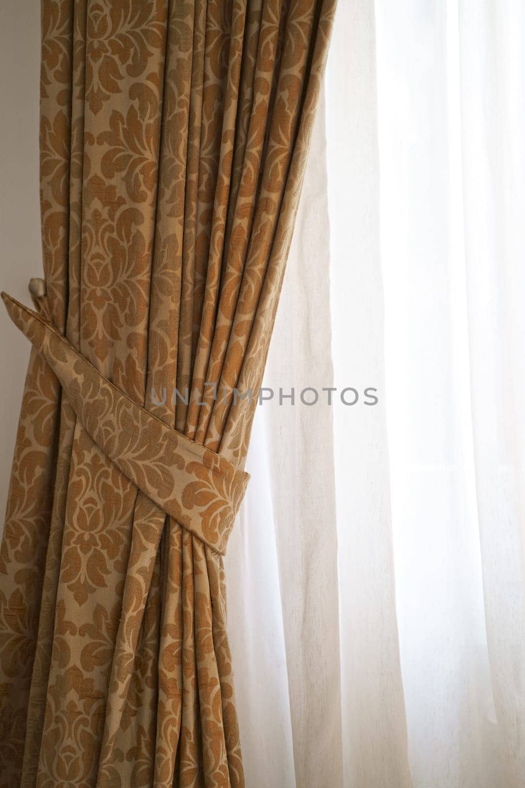 Beautiful brown curtains with a pattern. This photo shows beautiful curtains that would be the perfect addition to any home. by aprilphoto