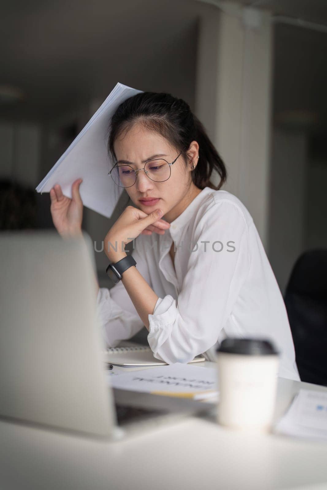 Business asian women are stress while working on laptop, Tired business woman with headache at office, feeling sick at work.
