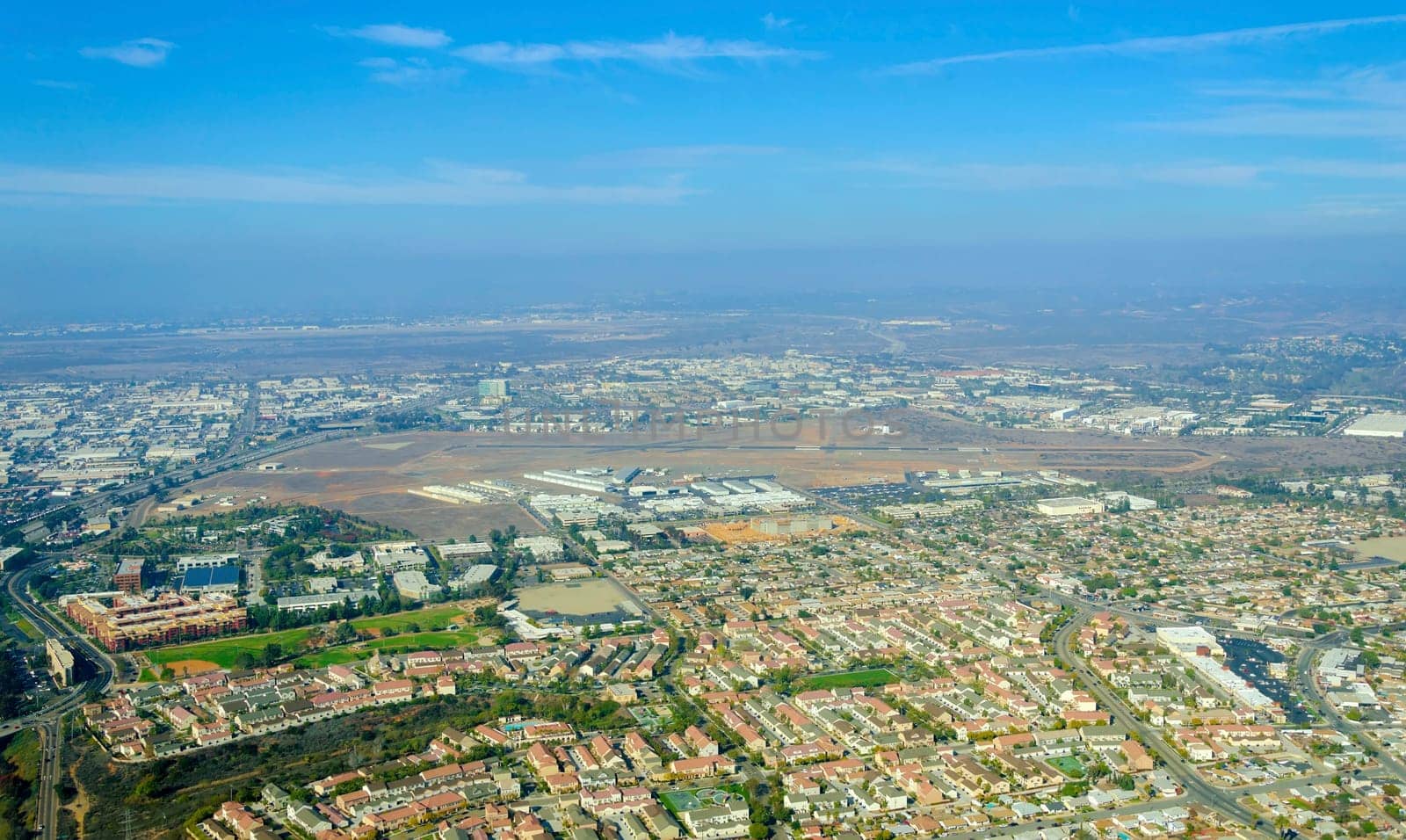 Aerial view of Mission Hills neighborhood and San Diego International Airport (Lindbergh Field), in Southern California, United States of America. An upscale affluent area in the city.