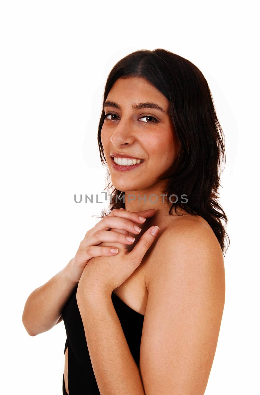 A closeup portrait of a young smiling woman in a black dress, isolated.on white background..