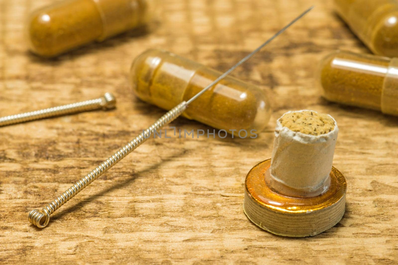 Acupuncture needle with moxa cone and herbal pills