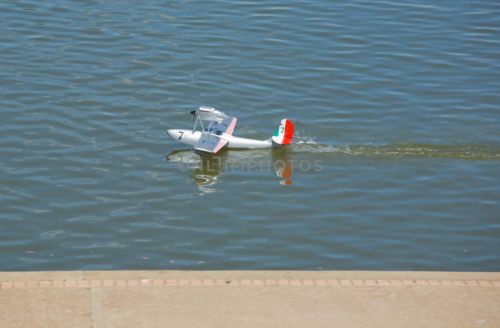 Radio controlled Hydroplane sailing over the Guadiana river surface, Badajoz, Spain