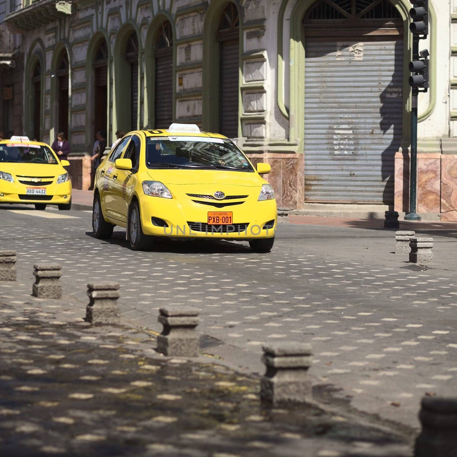 CUENCA,ECUADOR - FEBRUARY 13,2014: Taxi on the Mariscal Sucre Avenue on February 13,2014 in the city center of Cuenca,Ecuador