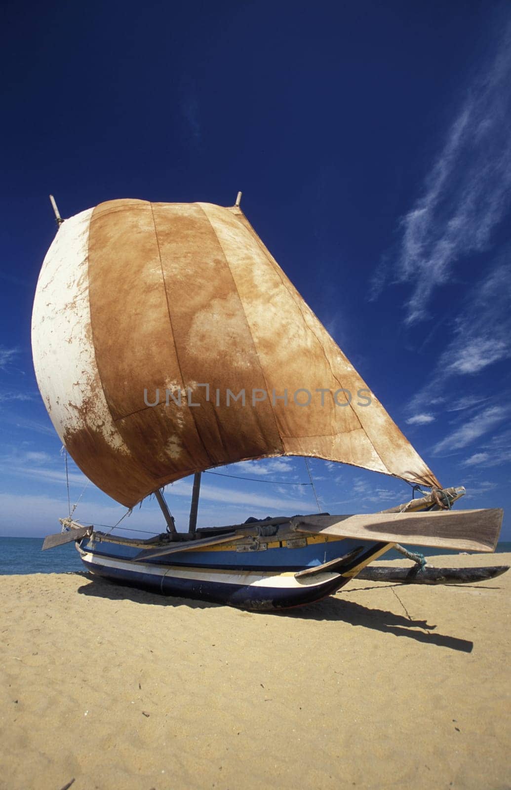 Asia,Indian Ocean,Sri Lanka,. A traditional fishing boat with fishermen in the Kuestendorf Negombo on the western coast of Sri Lanka. (URS FLUEELER).......