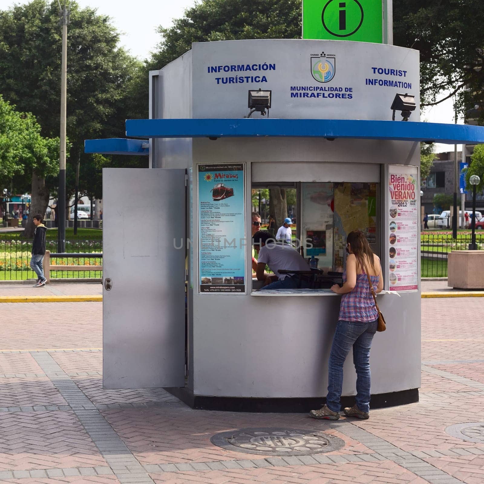 LIMA,PERU - FEBRUARY 11,2012: Unidentified people at the tourist information at the Kennedy Park in the district of Miraflores on February 11,2012 in Lima,Peru. Miraflores is the most touristy district of Lima,which has the most infrastructure for tourism.