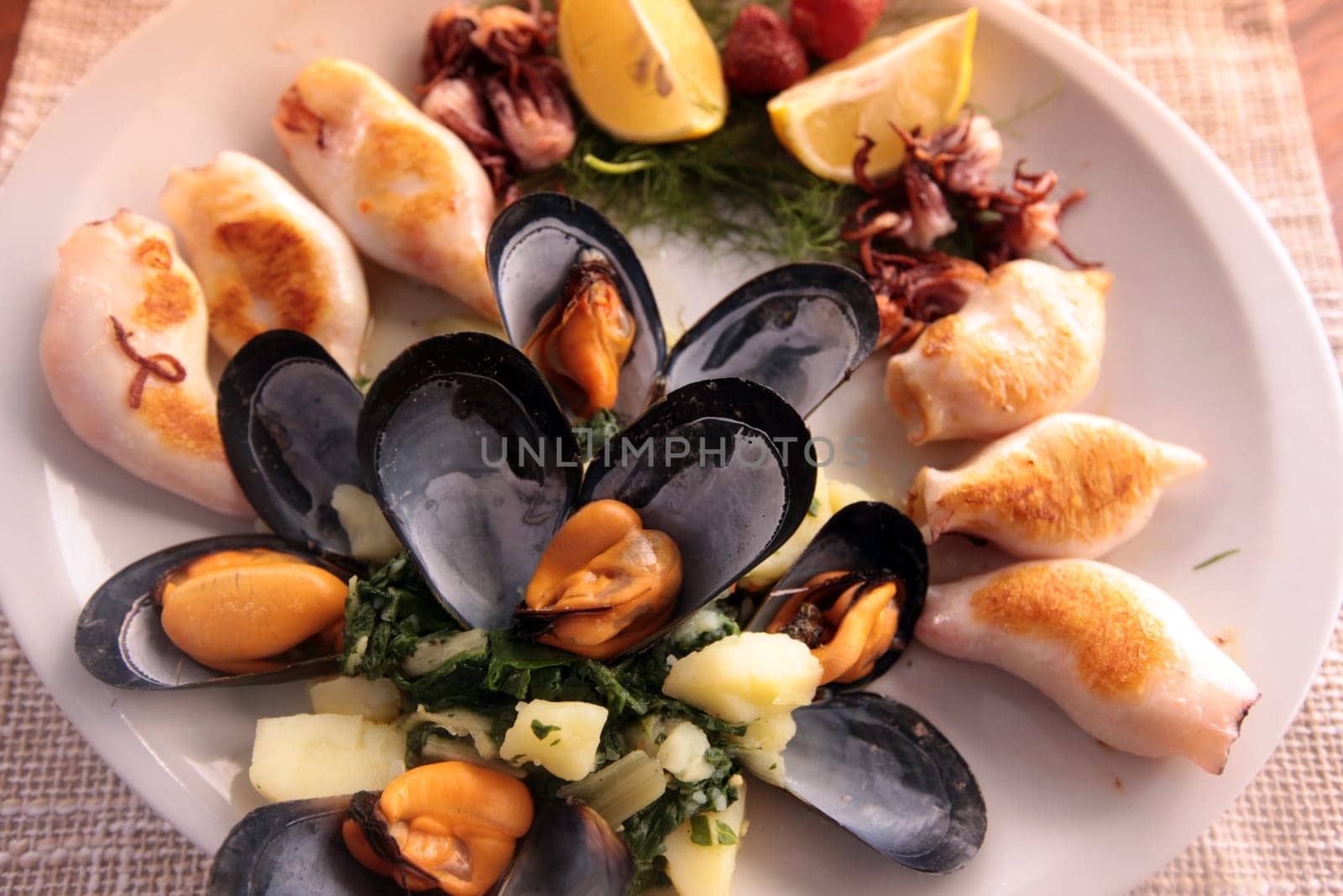 A seafood plate in a restaurant in the fishing village of Milocer near Sveti Stefan on the Mediterranean coast in Montenegro in the Balkans in Eastern Europe.