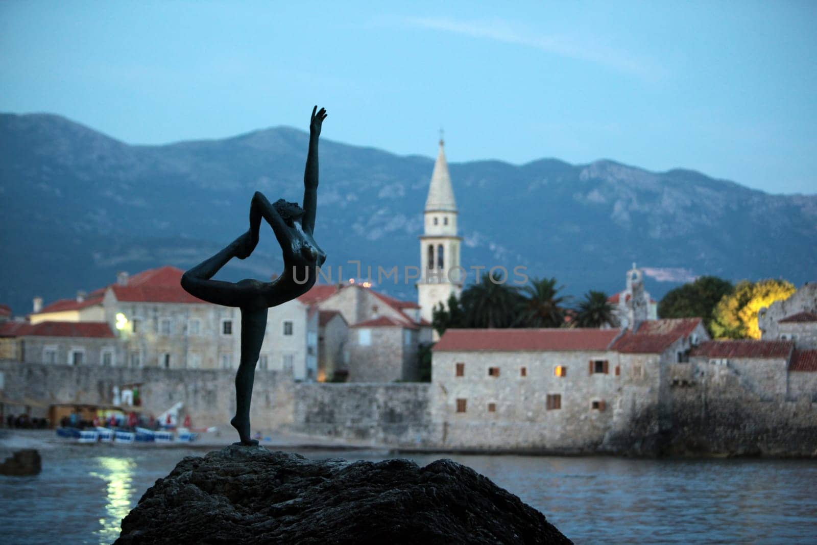 The old town with the church Of Sv. Ivan Krstitelji of the Adriatic city of Budva with many new apartments in Montenegro in the Balkans on the Mediterranean Sea in Europe.