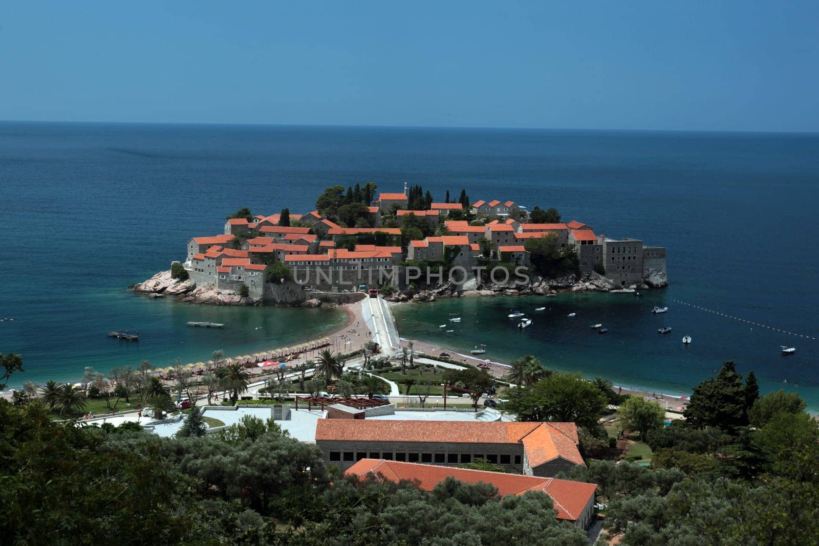 The old town island of Sveti Stefan in the Adriatic Sea on the coast in Montenegro in the Balkans on the Mediterranean Sea in Europe.