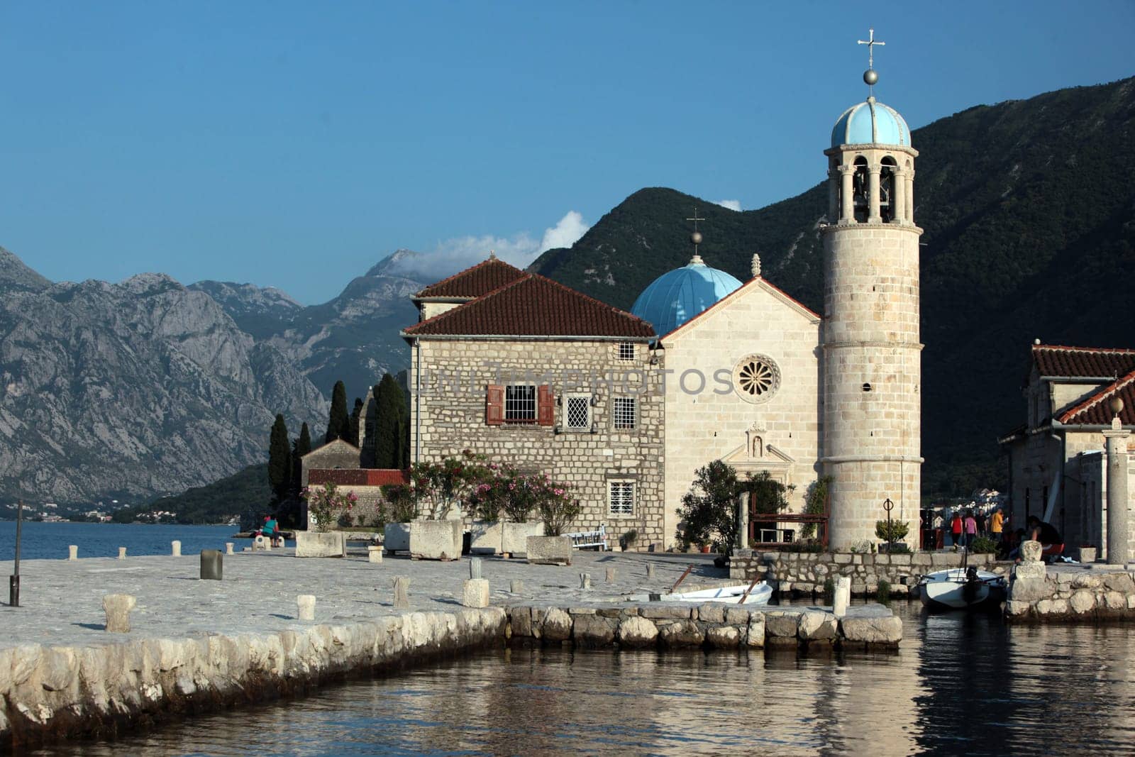 The island of Skrpjela in front of the village of Persat in the bay of Kotor on the Mediterranean Sea in Montenegro in the Balkans in Europe.